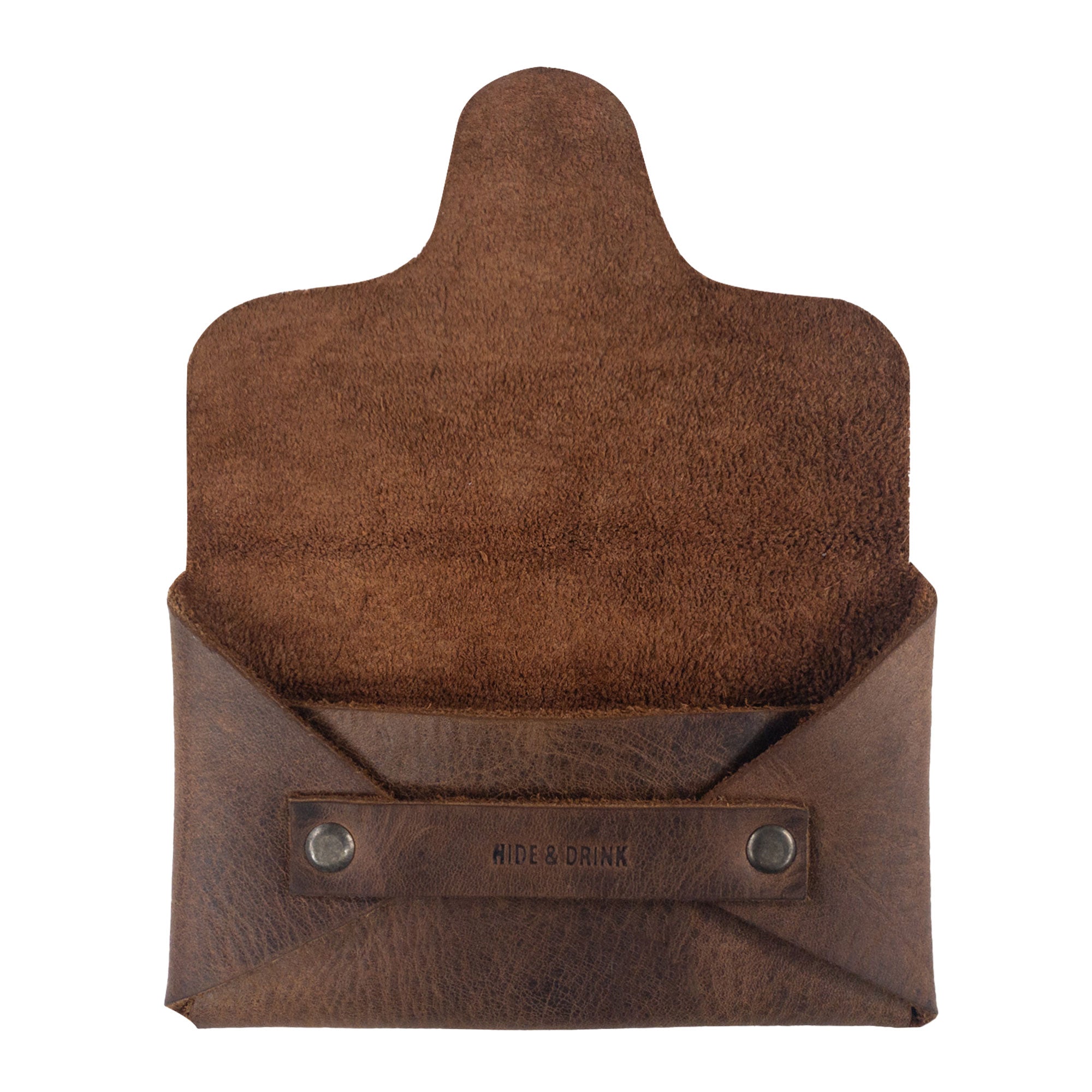 Hide & Drink's Snapless Business Card Holder viewed from the back, showcasing its minimalist design for both men and women. This sturdy pouch offers an ideal solution for organizing cash and cards, crafted from premium Full Grain Leather. Benefits from small batch production with exquisite hand cut and hand sewn artisanship from La Antigua Guatemala and Oaxaca Mexico.