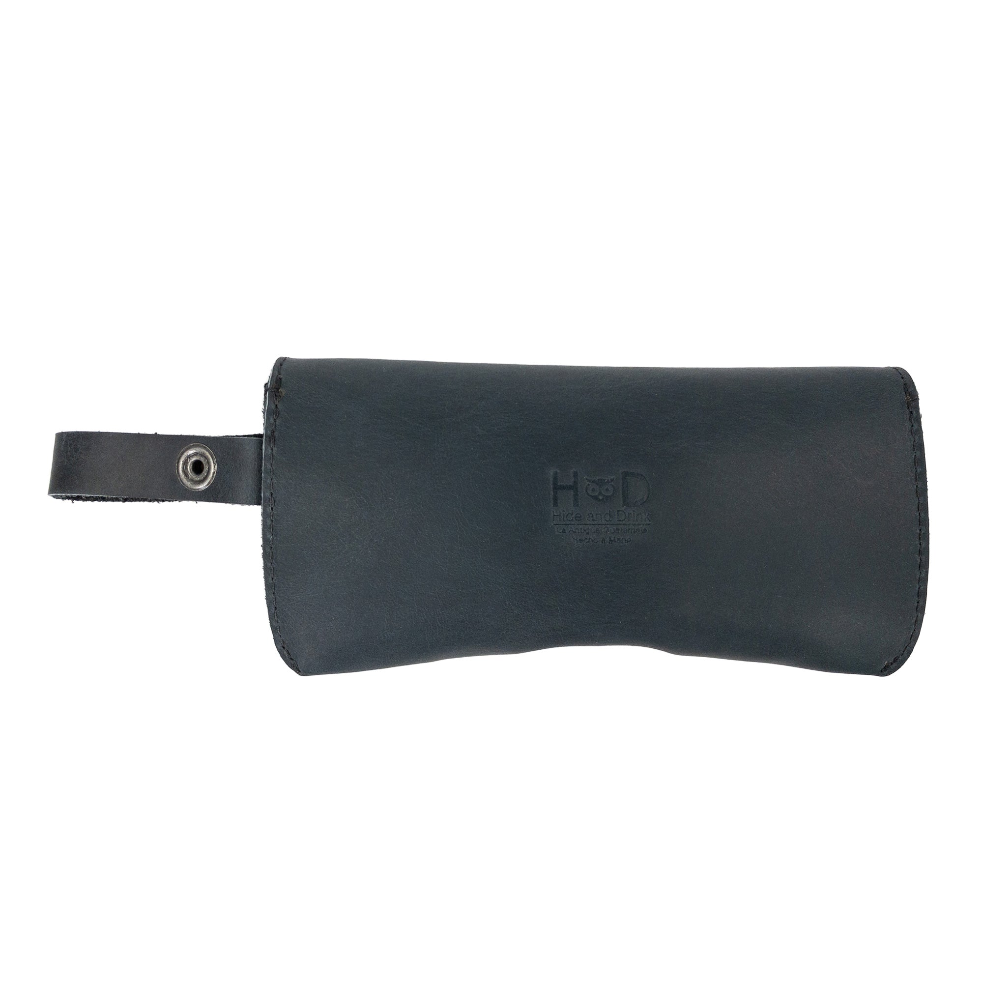 Closed Black Eyeglasses Case with Strap from Hide & Drink, made from durable full grain leather. This sunglasses case serves as a reliable protector for eyewear, showcasing artisanal craftsmanship and small batch production in La Antigua Guatemala & Oaxaca Mexico.