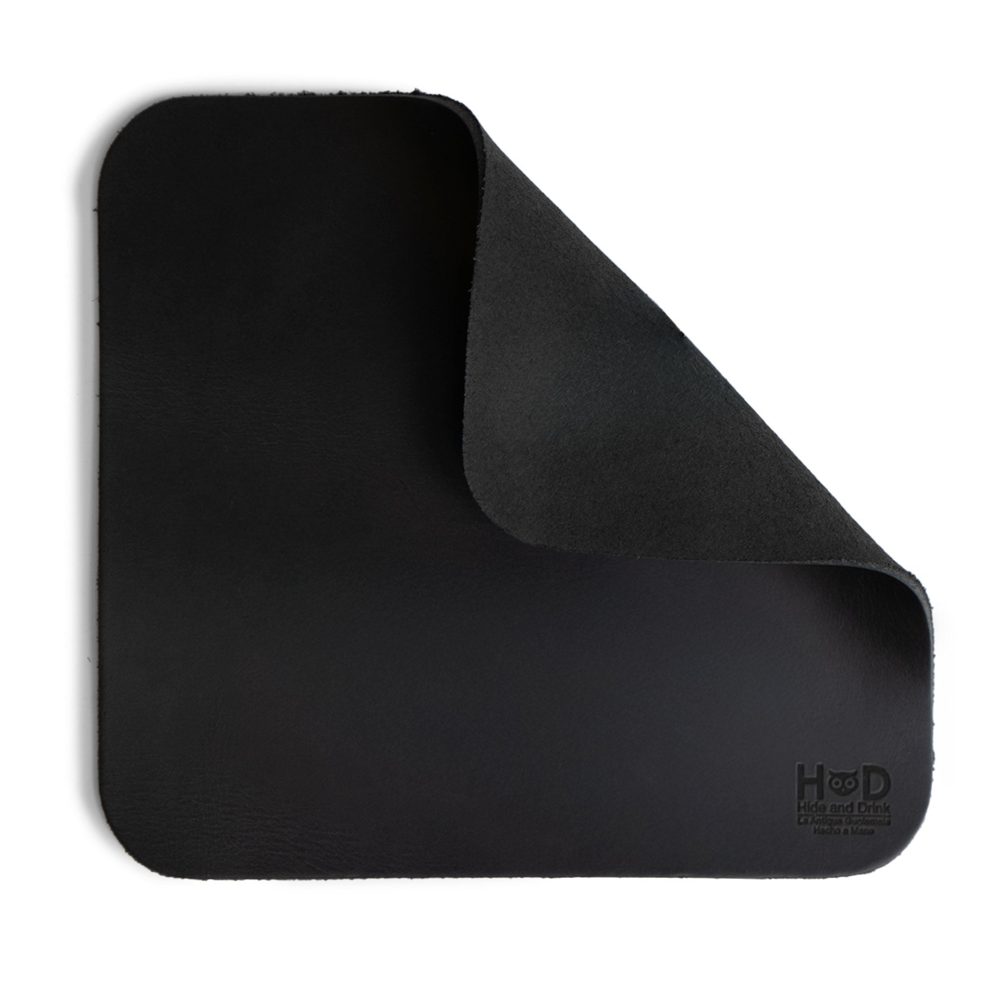 Hide & Drink Mousepad showcasing the rumpled texture of premium black leather, ideal for Apple Magic Mouse & PC. This anti-slip leather mousepad is designed for optimal ergonomics, handcrafted in La Antigua Guatemala & Oaxaca Mexico.