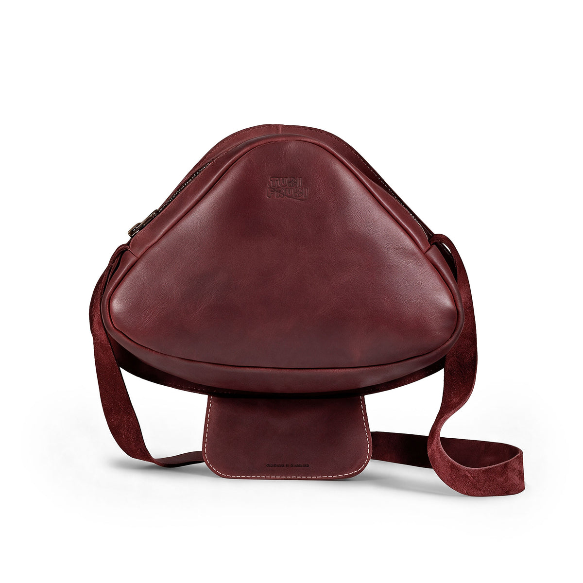 Mushroom-Shaped Leather Shoulder Bag by Tudi Frudi, featuring a whimsical design with an adjustable strap. This versatile crossbody bag is perfect for travel or as a messenger bag, crafted from Full Grain Leather, showcasing stockyardX's small batch production. Hand cut and sewn for quality, this artisan bag is handmade in La Antigua Guatemala.