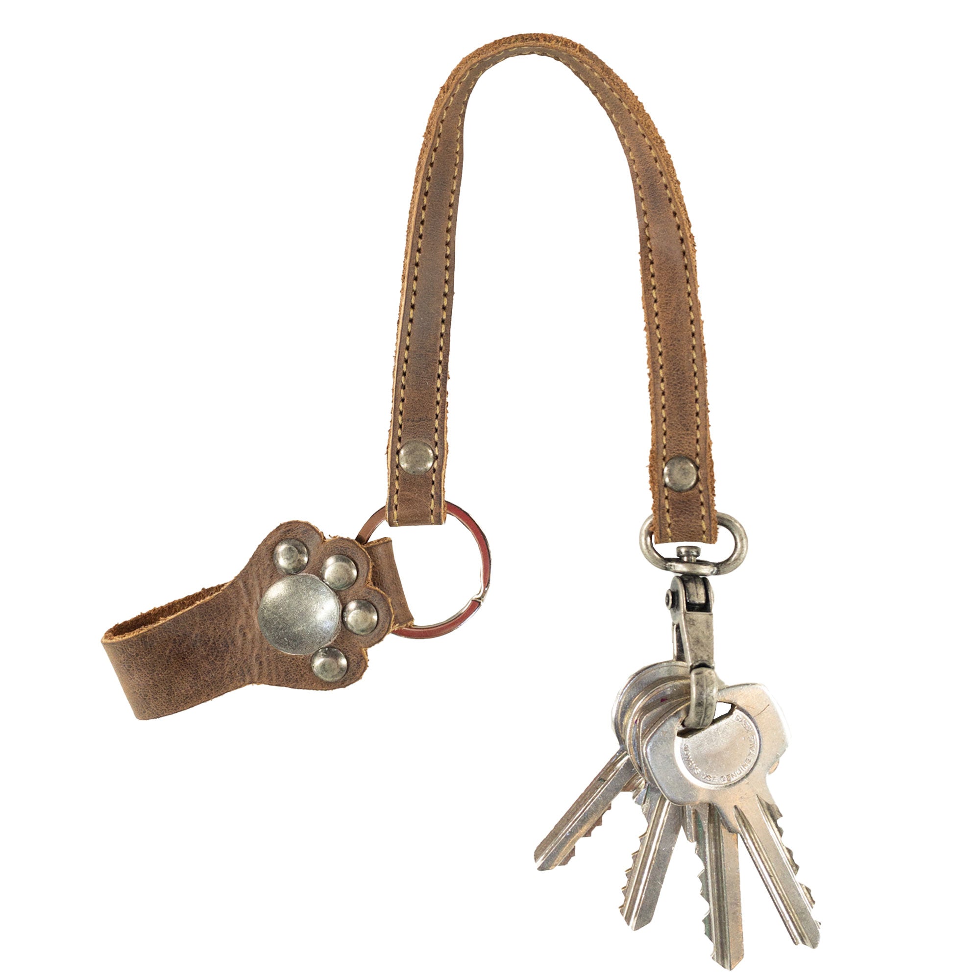Charming Paw Lanyard from Hide & Drink displaying keys and features a unique leather design. This key holder organizer is ideal for everyday use and makes a great gift, showcasing artisan craftsmanship and Full Grain Leather production in La Antigua Guatemala & Oaxaca Mexico.