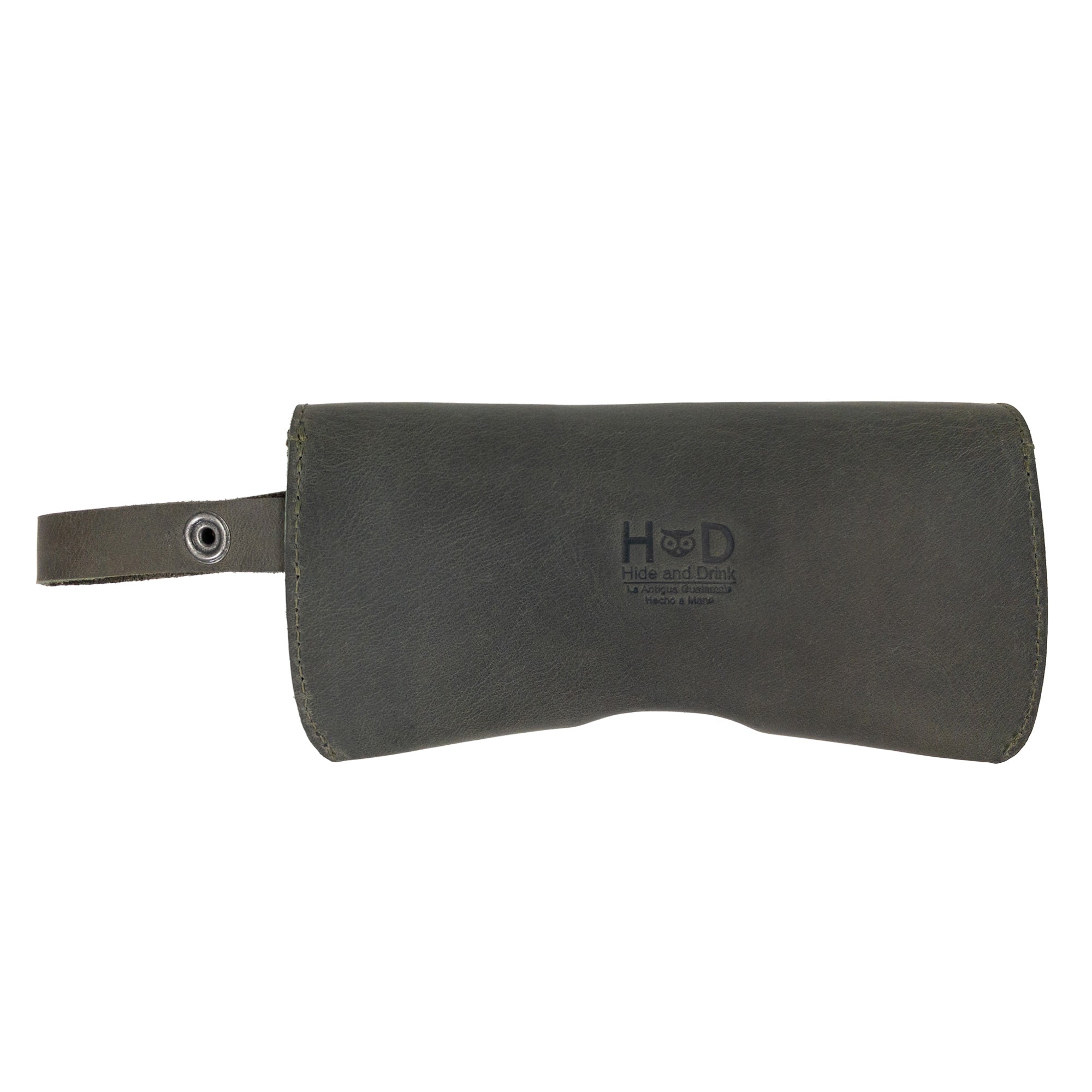 Closed Dark Green Eyeglasses Case with Strap from Hide & Drink, showcasing its robust full grain leather build. This eyewear protector serves as a stylish sunglasses case, emphasizing quality craftsmanship in La Antigua Guatemala & Oaxaca Mexico.