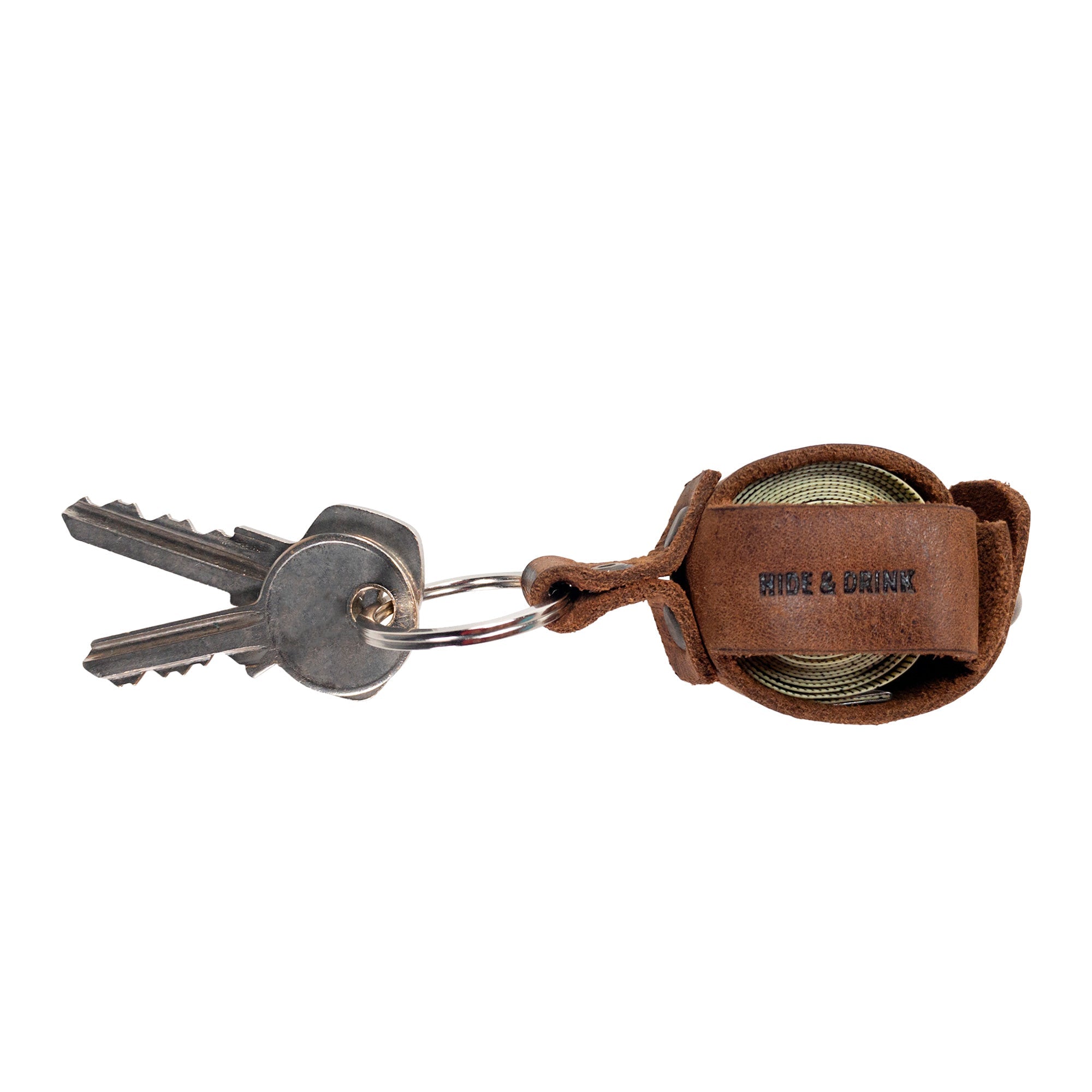 Hide & Drink Measuring Tape Holder Keychain with keys attached, designed to securely hold measuring tape (Tape not Included). Made from premium Full Grain Leather, this key ring organizer is a stylish addition for tailor accessories. Crafted through small batch production, showcasing hand cut, hand sewn materials with fire branded details, all handmade in La Antigua Guatemala & Oaxaca Mexico.