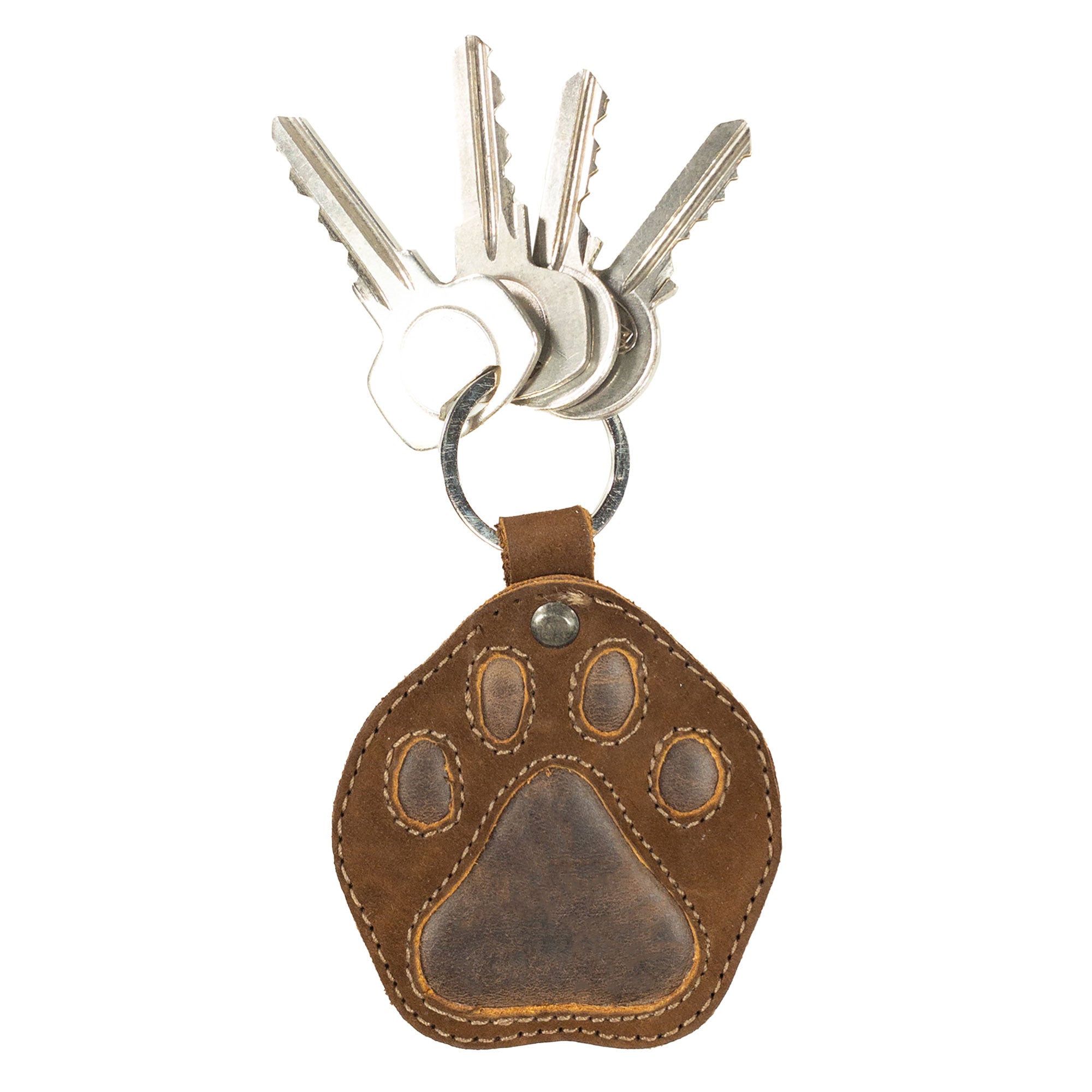 Dog Paw Keychain by Taco Dog, securely holding keys with a cute, stitched design. This charming key ring fob is made from durable full grain leather, making it a perfect gift. Artisan-made in La Antigua Guatemala & Oaxaca Mexico, it features a split keyring for easy attachment.