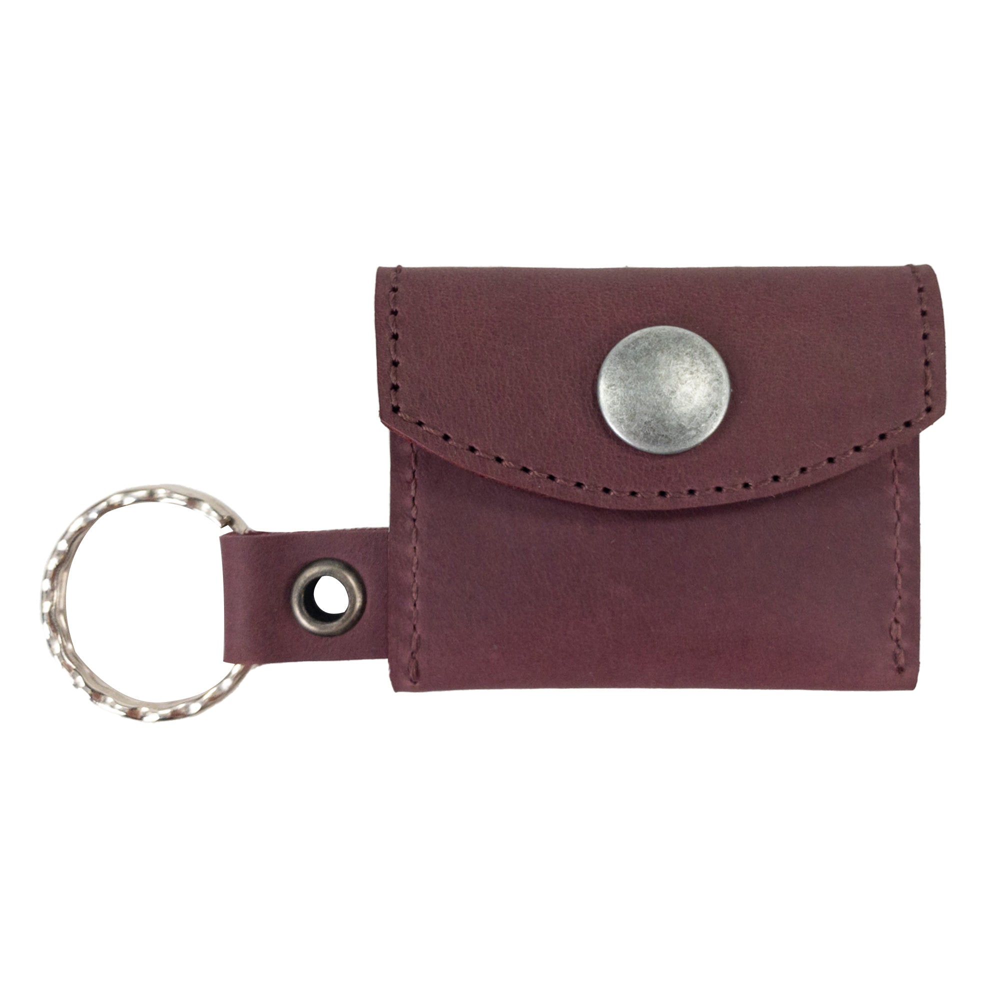 Functional Tiny Coin Holder Keychain by Hide & Drink exhibiting its compact nature, designed in durable Full Grain Leather. This Tiny Coin Holder is a result of artisan craftsmanship and small batch production.
