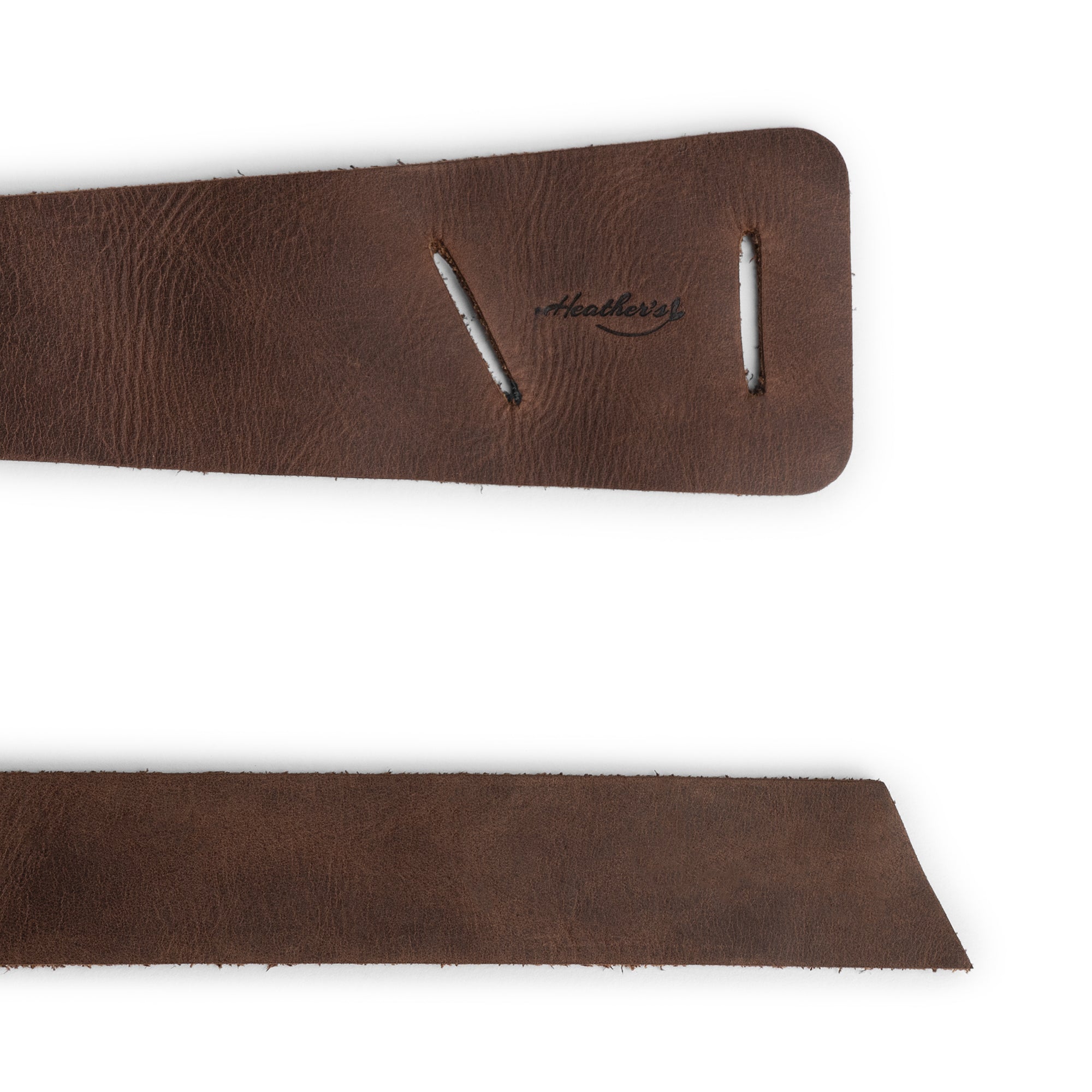 Close-up detail of Heather's Formal Belt for Women, highlighting the intricately designed buckle and strap made of Full Grain Leather. This Waist Strap is a testament to Small Batch Production with hand cut and hand sewn features, fire branded for added distinction. Artisan crafted in La Antigua Guatemala & Oaxaca Mexico.