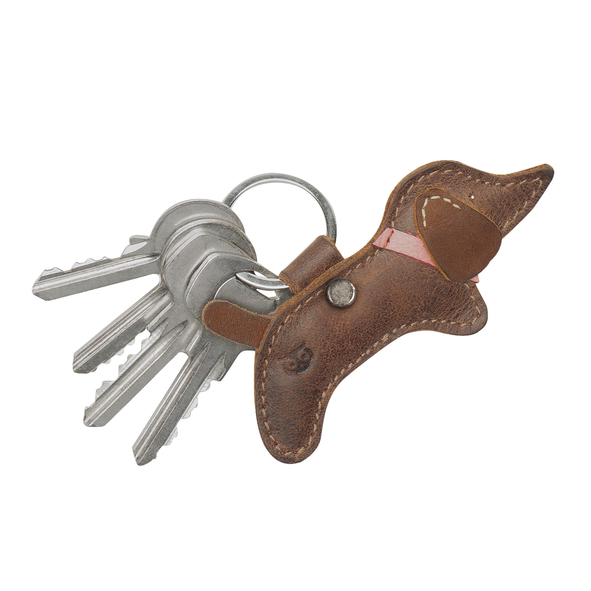Side view of the dog Critter Key Chain from Hide & Drink, showcasing its cute features and craftsmanship. This unique Animal Key Ring Holder offers both style and functionality, made from quality Full Grain Leather. Handmade in La Antigua Guatemala & Oaxaca Mexico.