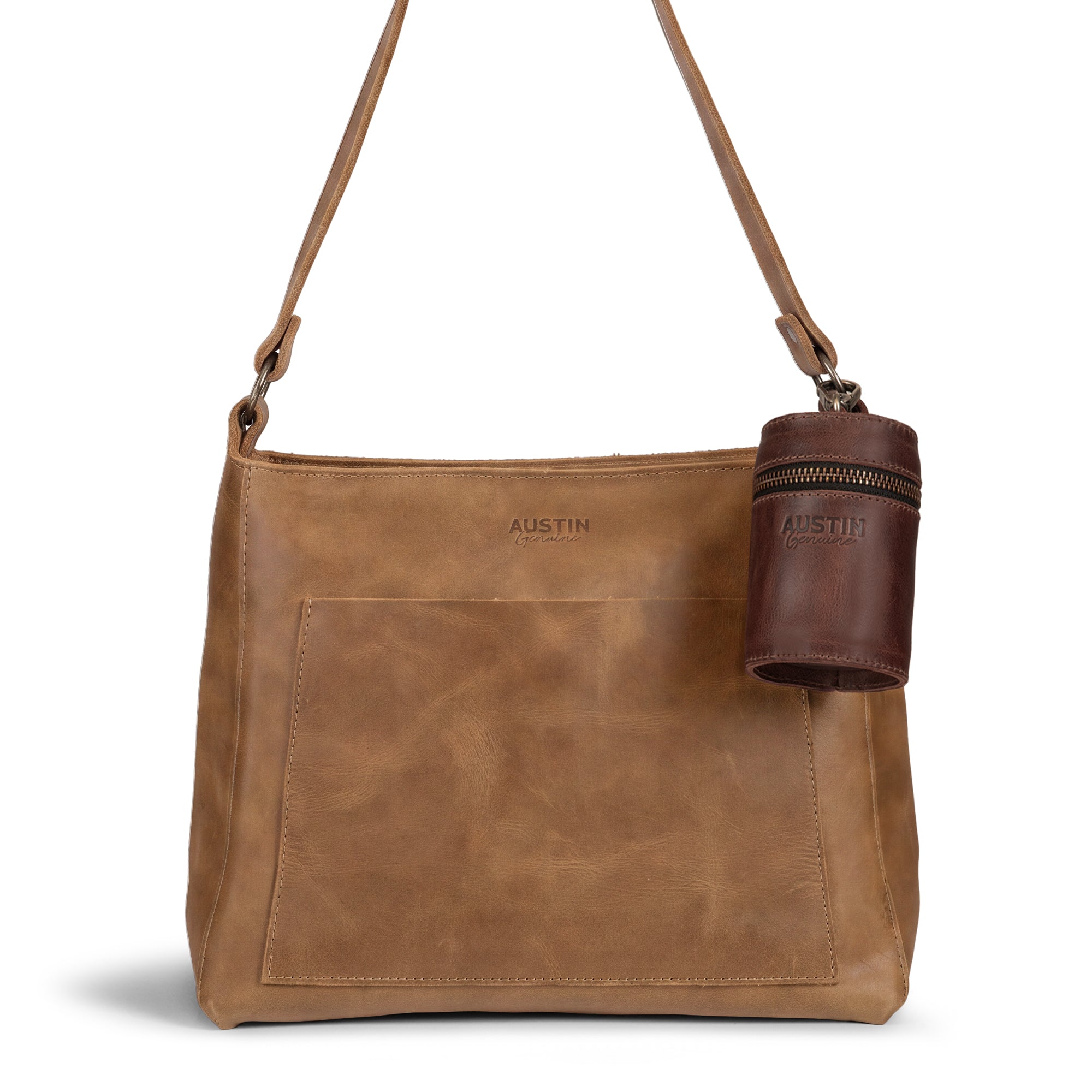 The Pease Mini Vanity Pouch by Austin Genuine, elegantly displayed with additional leather accessories. This handmade cylinder for coins serves as a money box and piggy bank, showcasing full grain leather quality, artisan craftsmanship, and small batch production, hand cut and hand sewn in La Antigua Guatemala & Oaxaca Mexico.