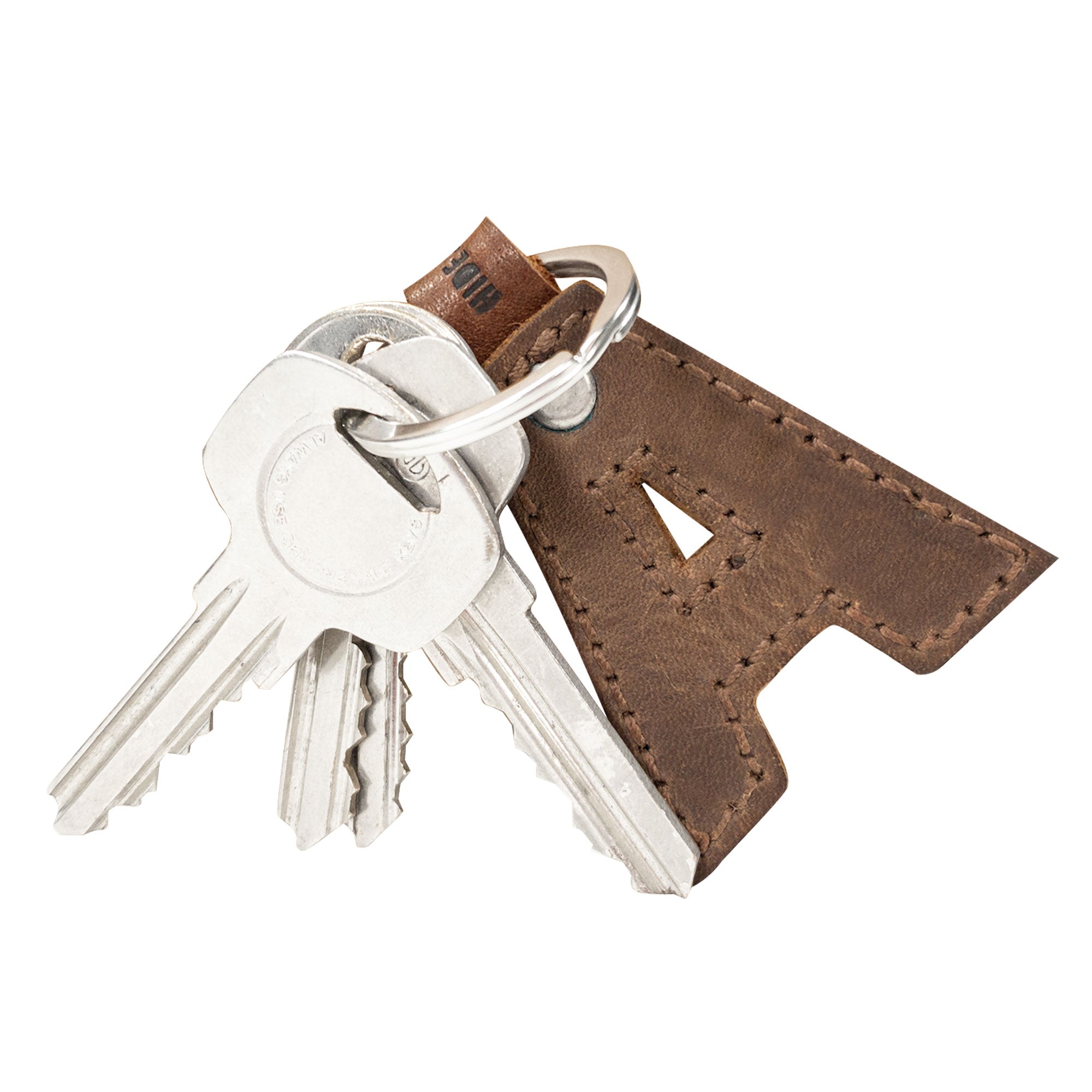 Close-up of 'A' thick leather Alphabet Letter Keychain by Hide & Drink, showcasing its durable craftsmanship. Made of full grain leather, this keychain features artisan touches from La Antigua Guatemala.