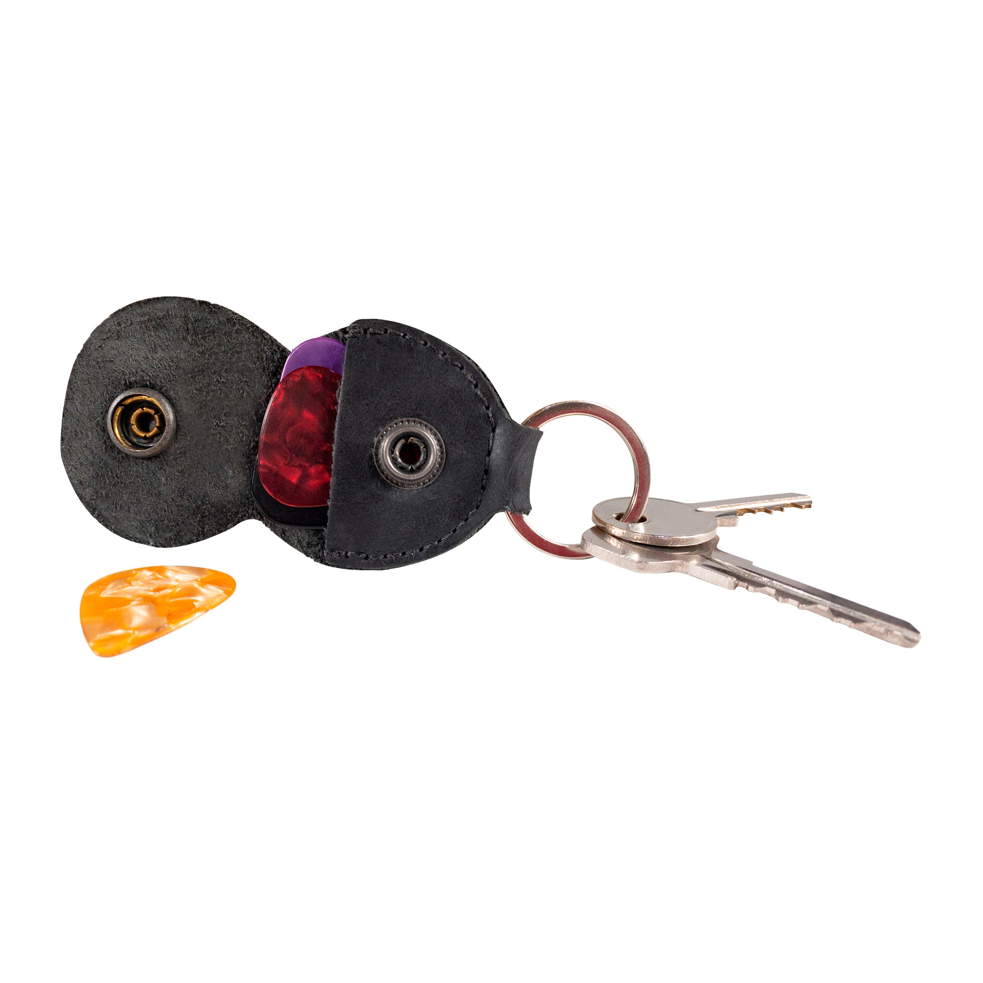 Hide & Drink Key Chain & Guitar Pick Holder, revealing a close-up of an elegant design imbued with artisan craftsmanship. Made from Full Grain Leather, this key organizer is essential for guitar players, produced with care in La Antigua Guatemala & Oaxaca Mexico.