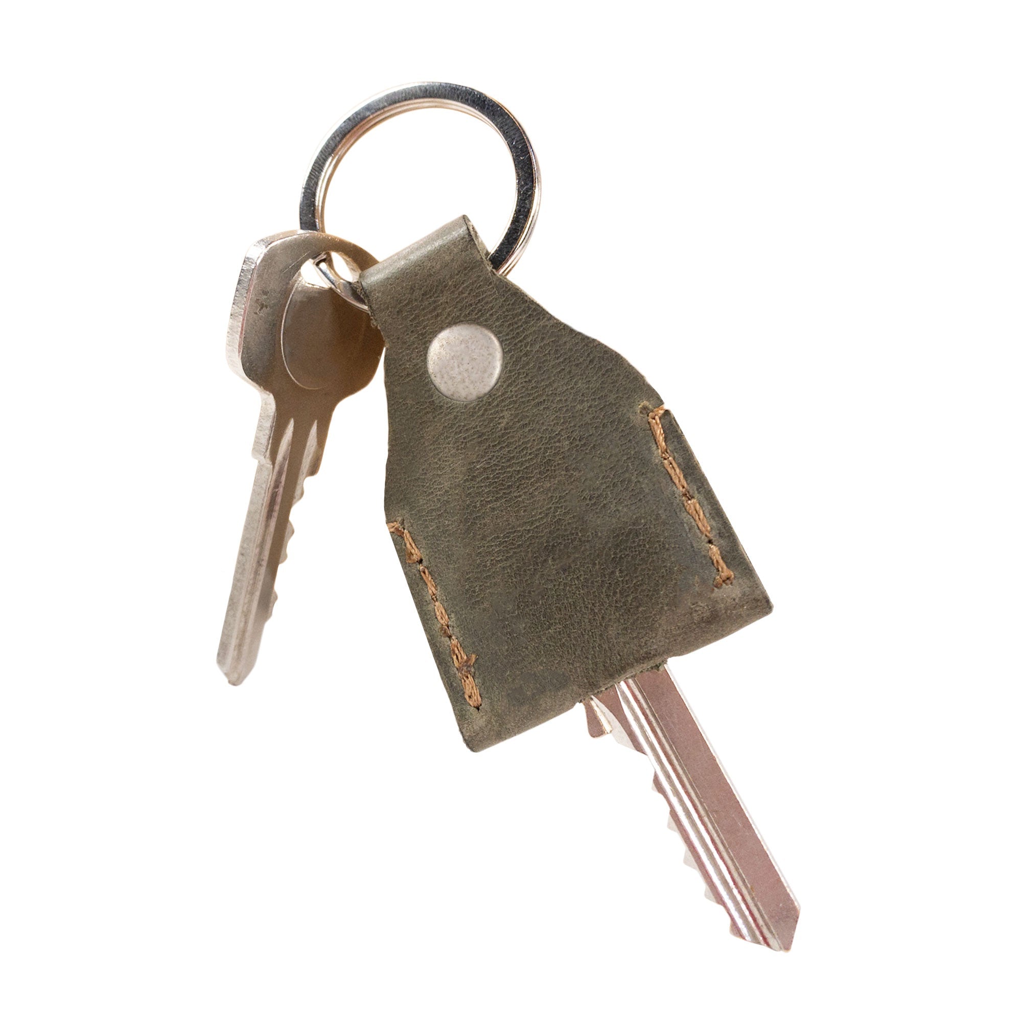 Reverse side of chocolate brown Hide & Drink Key Holder featuring subtle branding. This Key Holder is both functional as a Keychain Organizer and stylish as an emergency coin pouch, showcasing the premium Full Grain Leather craftsmanship. Handmade in La Antigua Guatemala & Oaxaca Mexico.