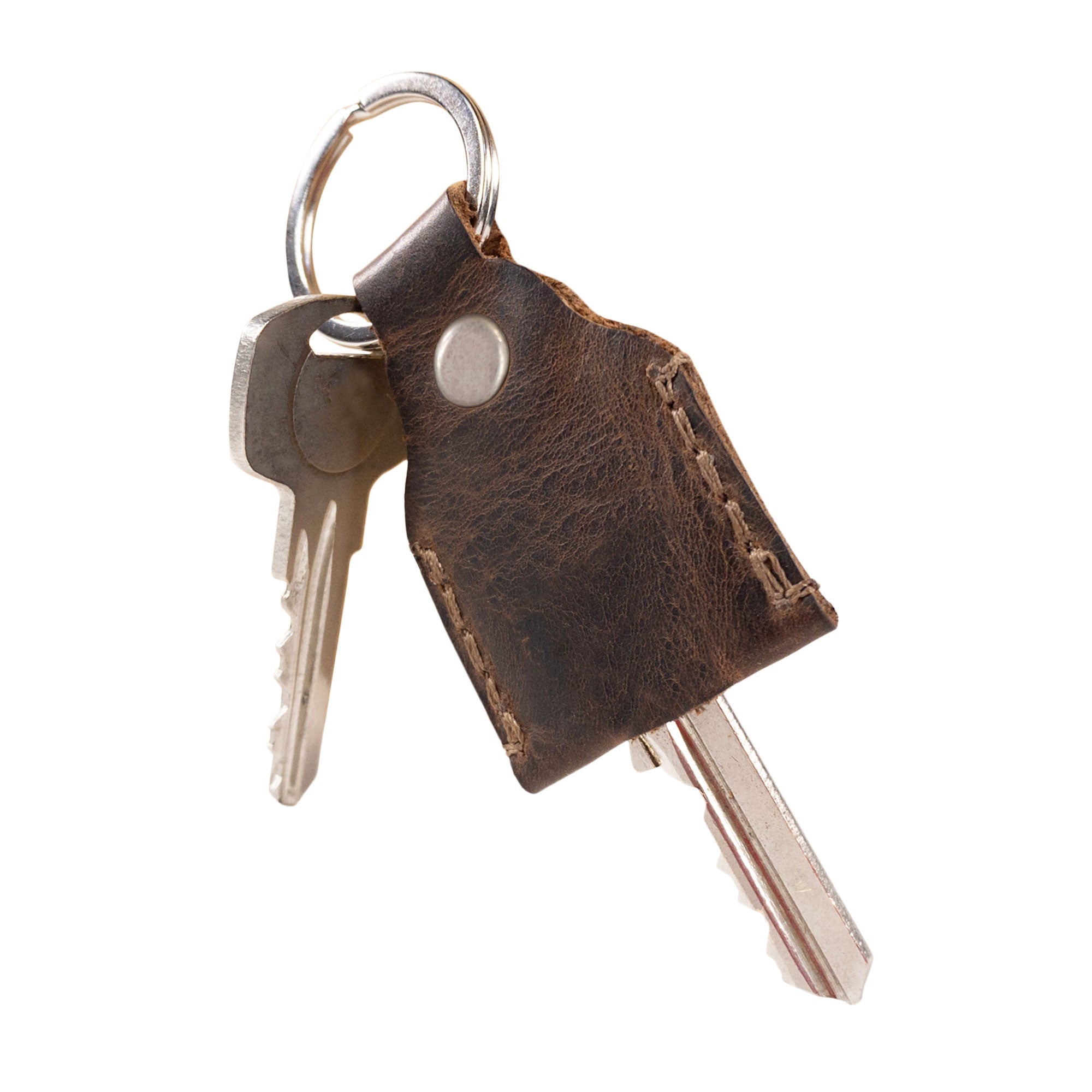 Hide & Drink Key Holder neatly holds keys, emphasizing its rustic charm made from durable Full Grain Leather. An ideal Keychain Organizer, this Key Holder functions also as an emergency coin pouch and pocket accessory. Hand cut and hand sewn by skilled artisans, this product represents small batch production in La Antigua Guatemala & Oaxaca Mexico.
