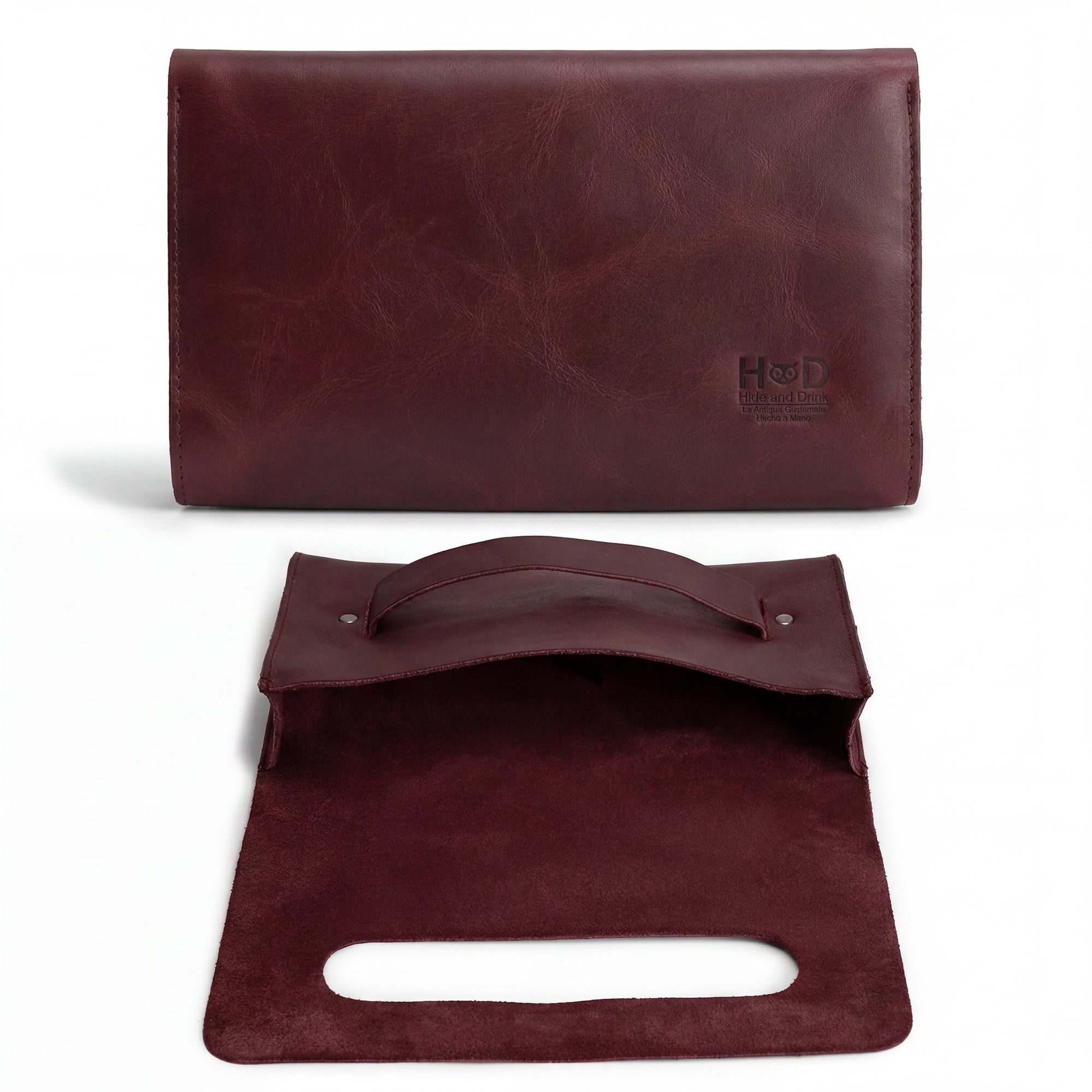Open style of the maroon Clutch Bag With Handle from Hide & Drink, highlighting its simple elegance. This Full Grain Leather Clutch Bag is perfect for women, a great handbag or night bag thoughtfully crafted in Guatemala and Mexico.