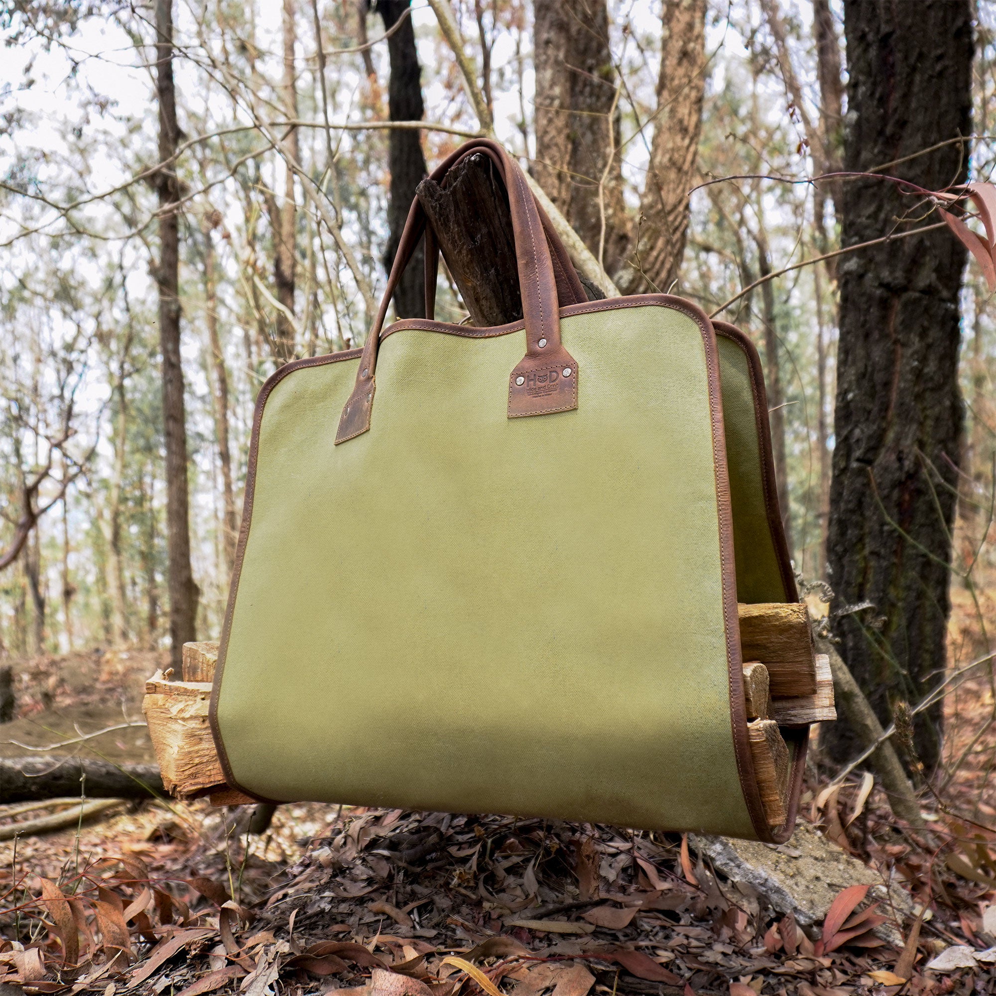 Hide & Drink Firewood Bag unfolded, revealing the high-quality craftsmanship with reinforced stitching and a rustic style that's both practical and attractive. Firewood Bag With Leather Liner, Full Grain Leather, StockyardX, Small Batch Production, Hand Cut, Hand Sewn, Fire Branded, Artisan, Handmade in La Antigua Guatemala & Oaxaca Mexico.