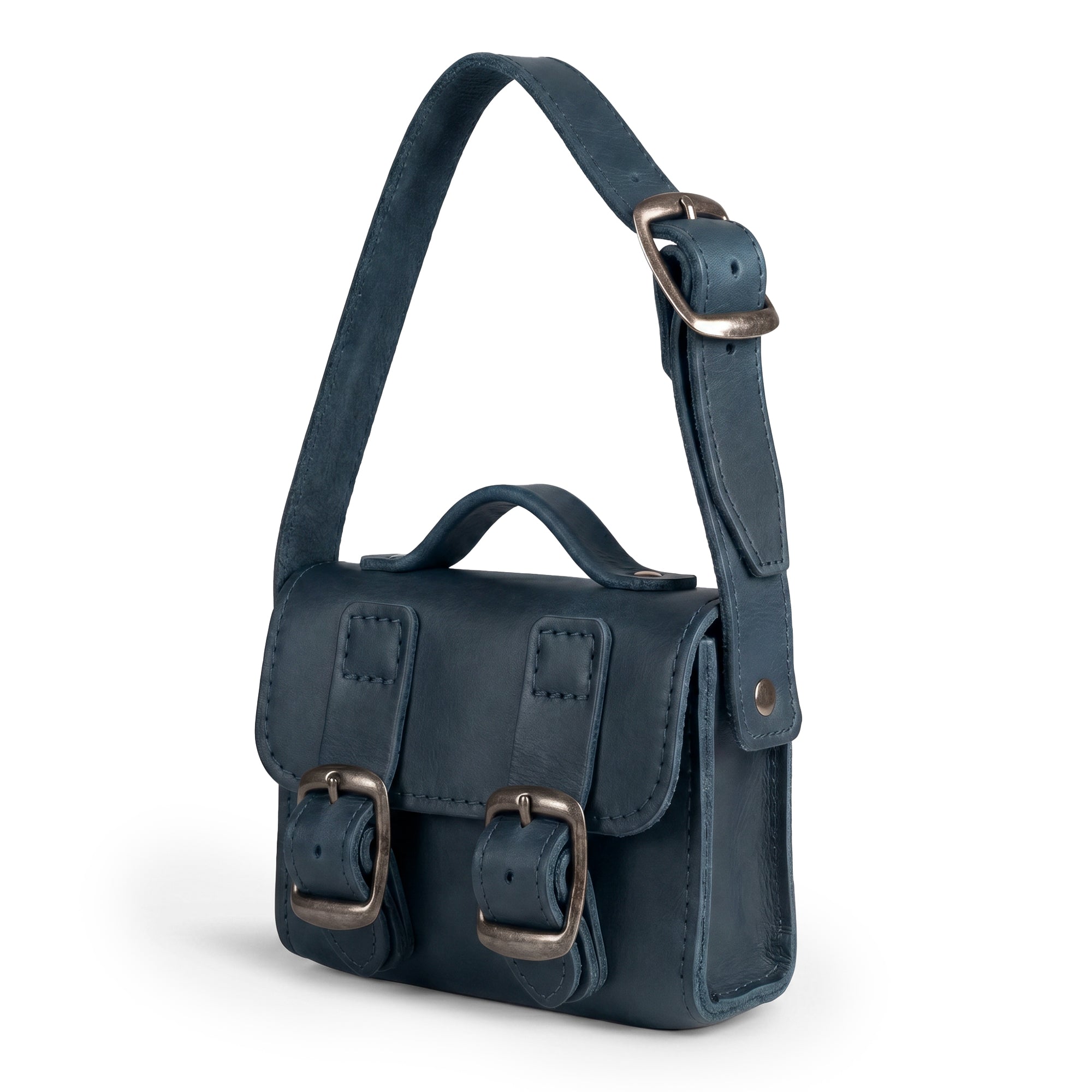 Inside view of the deep blue Tiny Messenger Bag by Hide & Drink, featuring a spacious compartment for cash and coins. This lovely Mini Messenger Bag Charm made from Full Grain Leather serves as an excellent keychain or fashionable handbag accessory, crafted by artisans in La Antigua Guatemala.