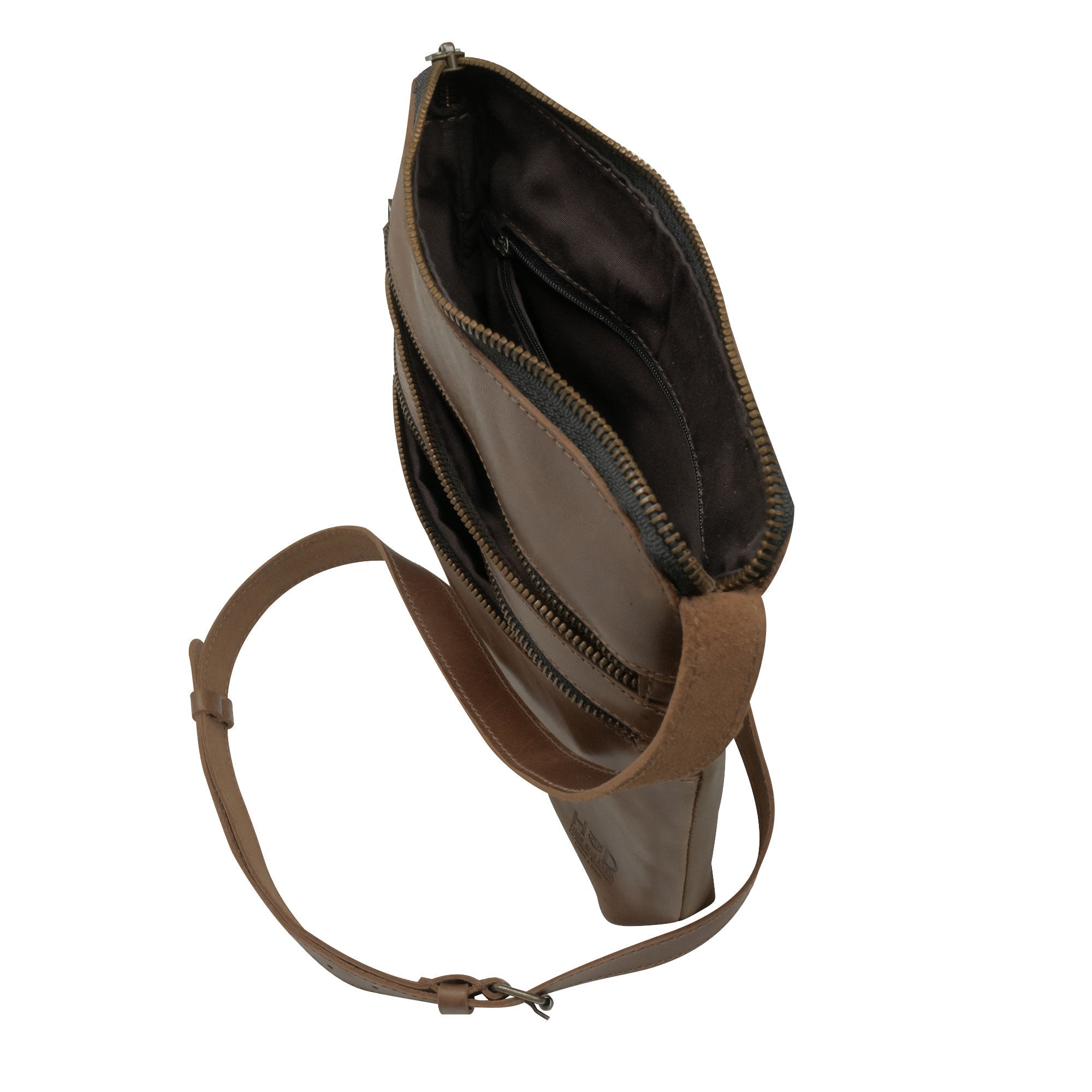 Inside view of the 3 Zipper Satchel by Hide & Drink, showing its spacious interior designed for organization. This handbag combines style and convenience, made from premium full grain leather. 3 Zipper Satchel - Versatile Handbag, Handmade from Full Grain Leather and Plaid Cotton, Small Batch Production, Hand Cut, Hand Sewn, Fire Branded, Artisan, Handmade in La Antigua Guatemala & Oaxaca Mexico.