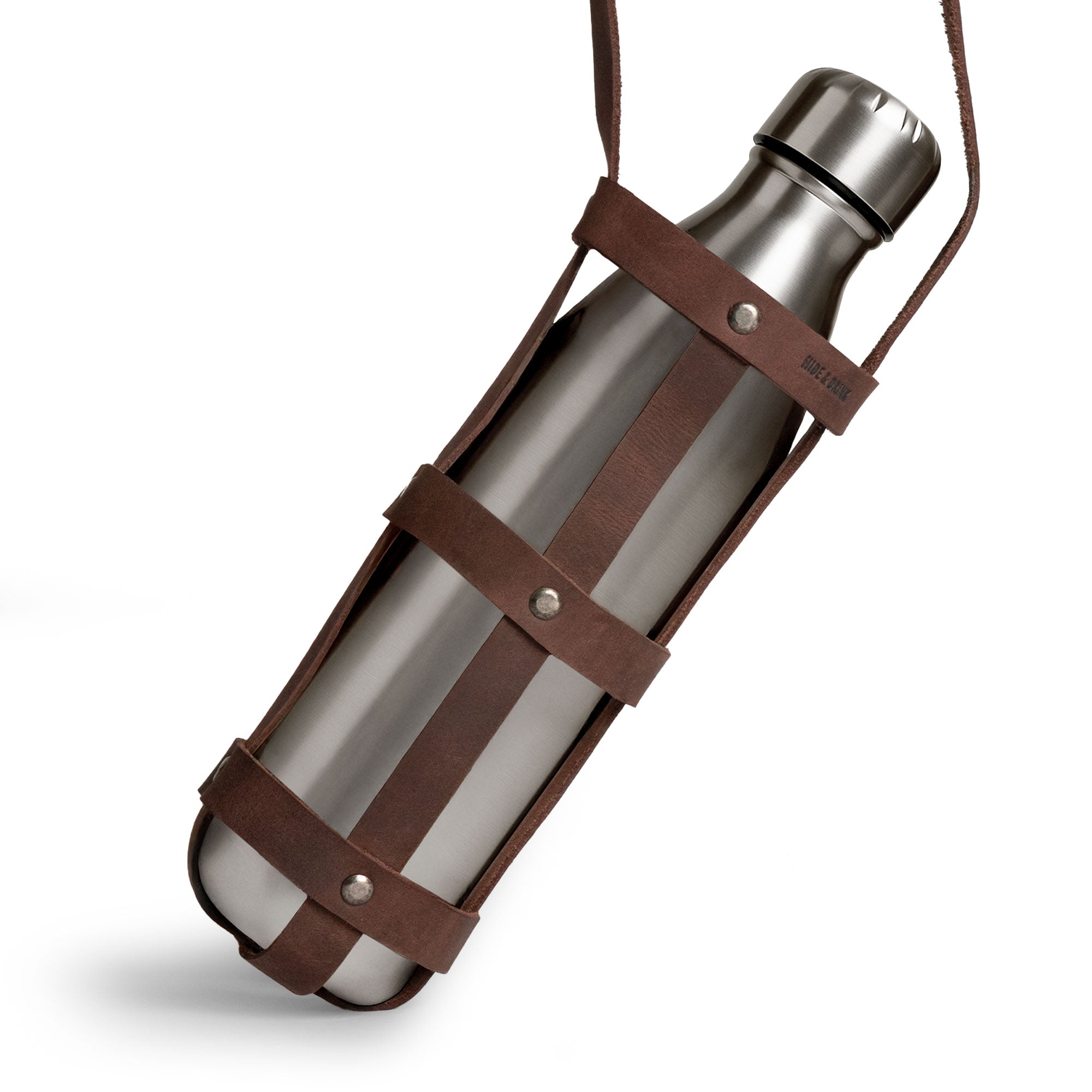 Close-up of the Hide & Drink Water Bottle Holder, displaying its Rustic Leather Water Bottle Holder With Adjustable Strap. Designed to fit 2.5 in. diameter bottles, this beautifully crafted holster is made of Full Grain Leather, emphasizing hand cut and fire branded techniques. An artisan product that hails from La Antigua Guatemala & Oaxaca Mexico.