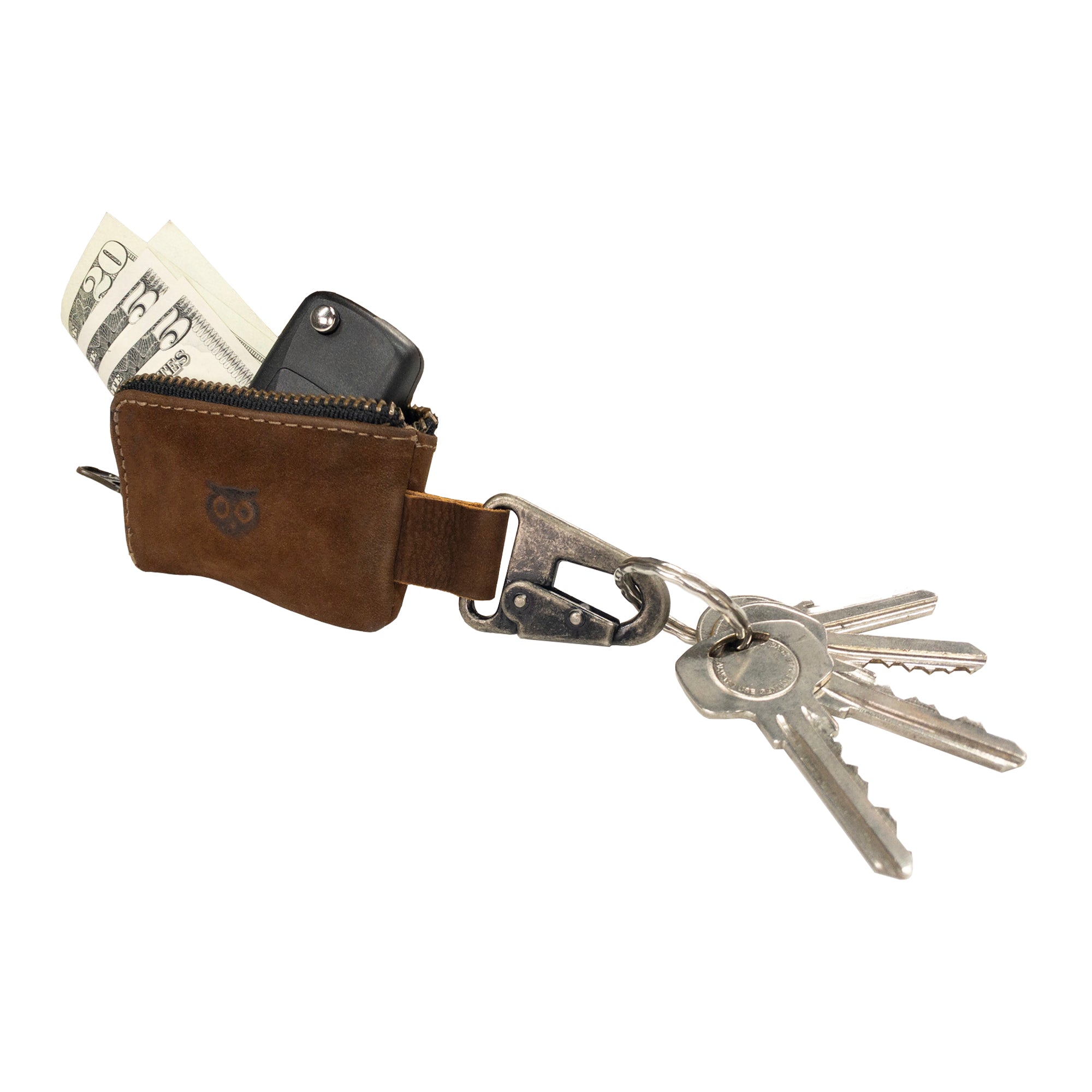 The Car Key Holder from Hide & Drink features a rustic leather storage that can hold cash and a car key fob, ideal for quick access. This Car Key Holder's design allows it to function as a cash zipper case with a durable nickel metal clasp, crafted from full grain leather. It's perfect for organizing headphone and charging cables, memory cards, and flash drives. Enjoy artisan quality with small batch production, hand cut, hand sewn details, handmade in La Antigua Guatemala & Oaxaca Mexico.