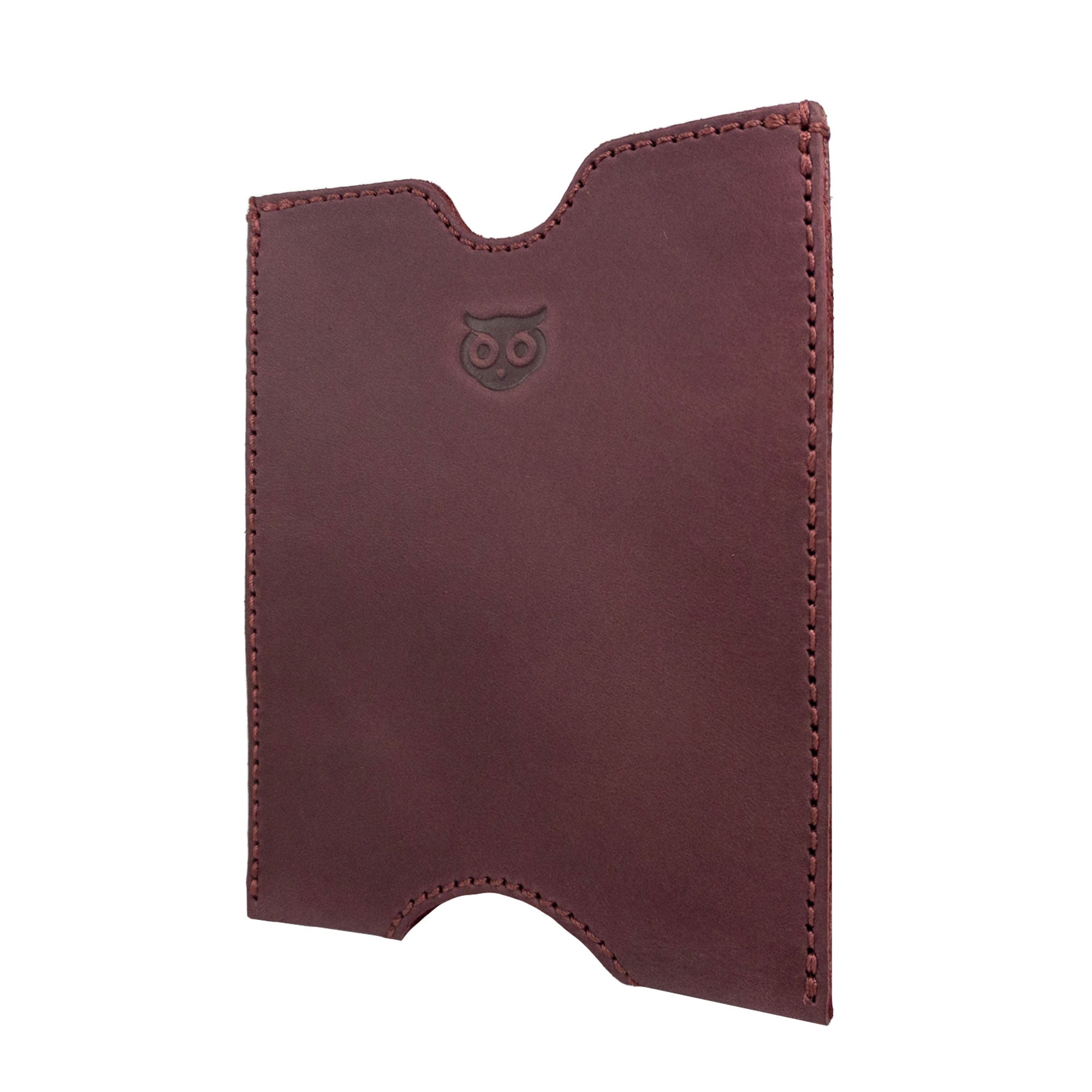 Side angle of the burgundy Hide & Drink Passport Sleeve, highlighting its handcrafted design in Full Grain Leather. This Travel Passport Pocket Sleeve showcases artisan workmanship with details reflecting small batch production, handmade care, and fire branding techniques in La Antigua Guatemala & Oaxaca Mexico.