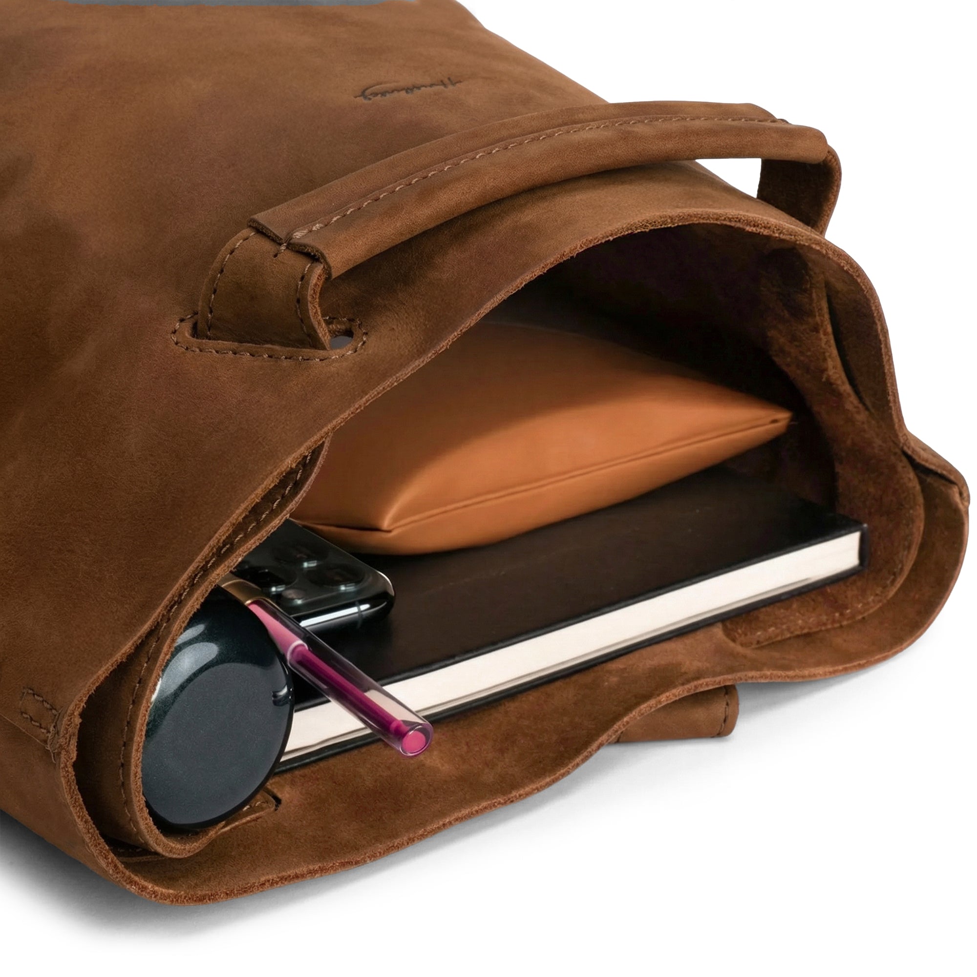 Interior view of the Convertible Backpack to Shoulder Bag by Heather's, revealing its spacious compartment. Ideal for women on the go, this squared purse is made from Full Grain Leather, combining functionality and style. This unique bag is handcrafted with care through small batch production, including hand cut, hand sewn, and fire branded features, showcasing artisan skill from La Antigua Guatemala & Oaxaca Mexico.