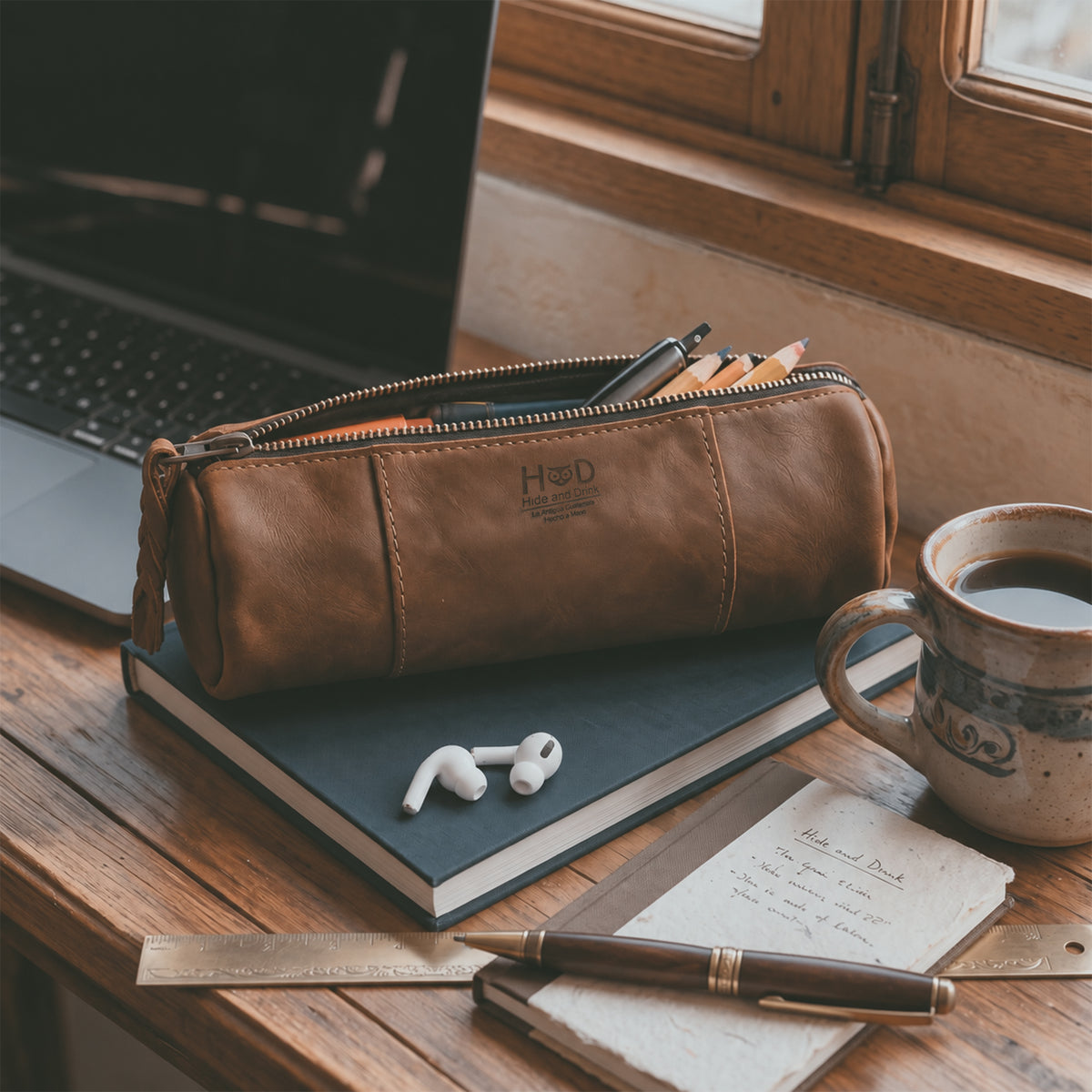 Inside view of the Utility Cylinder Case by Hide & Drink, highlighting its spacious interior for office supplies or cables. This rustic, handmade bag is crafted from Full Grain Leather in La Antigua Guatemala. Cylinder Case, Classic Bag, Small Batch Production, Artisan.