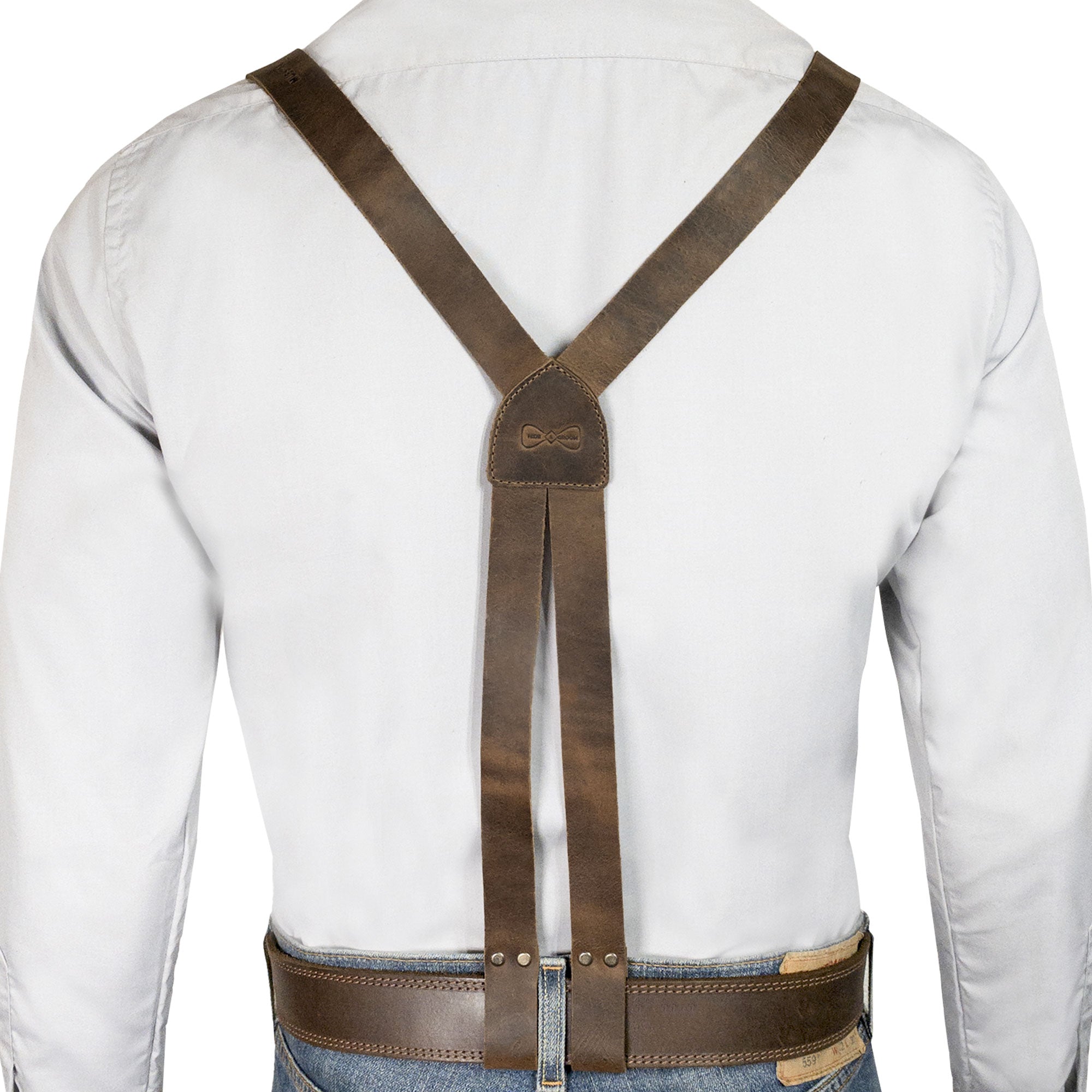The back view of Hide & Groom's X Back Formal Suspenders with Belt Loops, showcasing a stylish design that's perfect for formal wear. Created with adjustable straps and full grain leather, these suspenders are hand cut and sewn in La Antigua Guatemala, ideal for groomsmen and dinner parties.