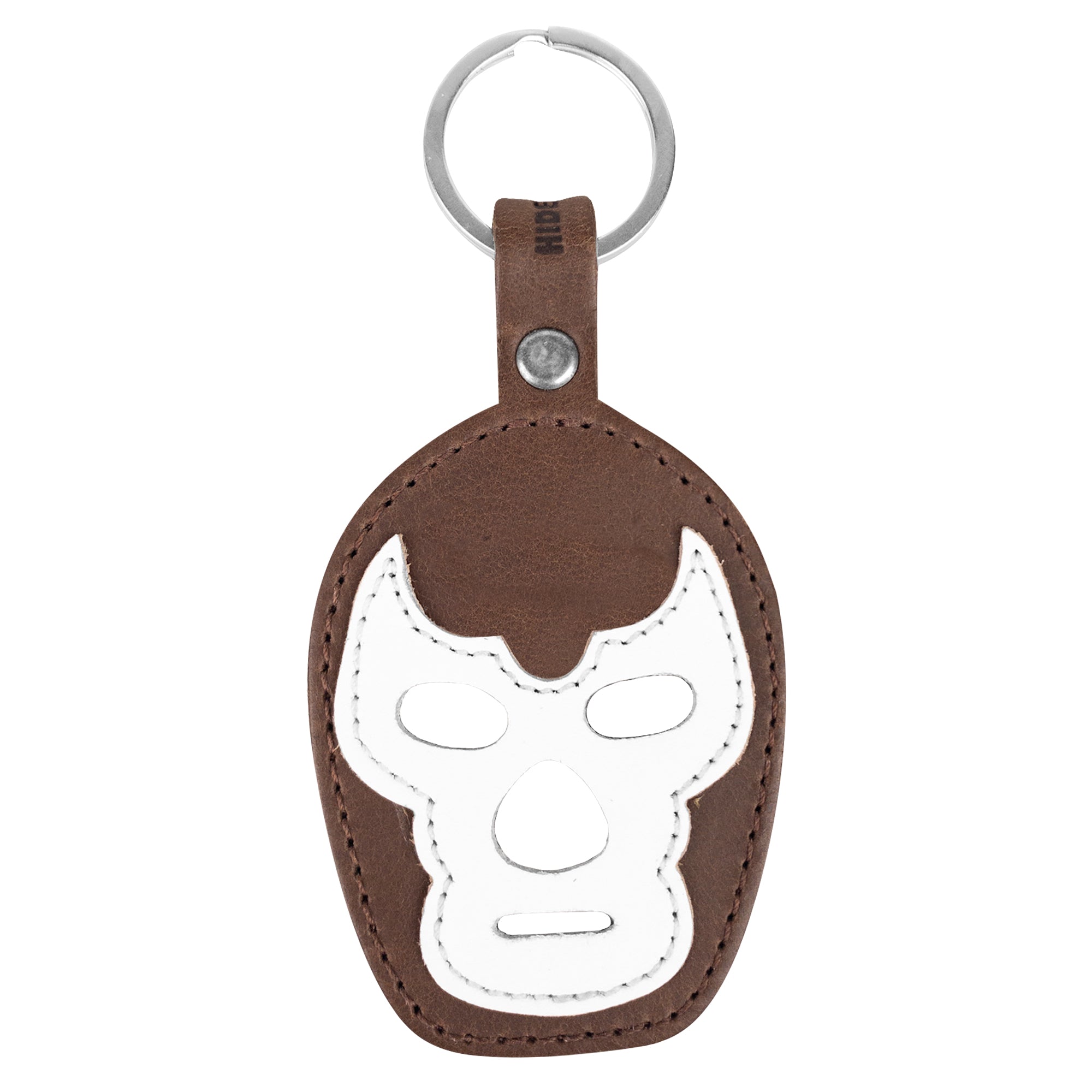 The Luchador Mask Leather Keychain elegantly showcasing its unique design and utility as a keyring. From Hide & Drink, this key organizer is made with top quality full grain leather, underscoring the artistry of small batch production and featuring hand cut and hand sewn details in La Antigua Guatemala and Oaxaca Mexico.