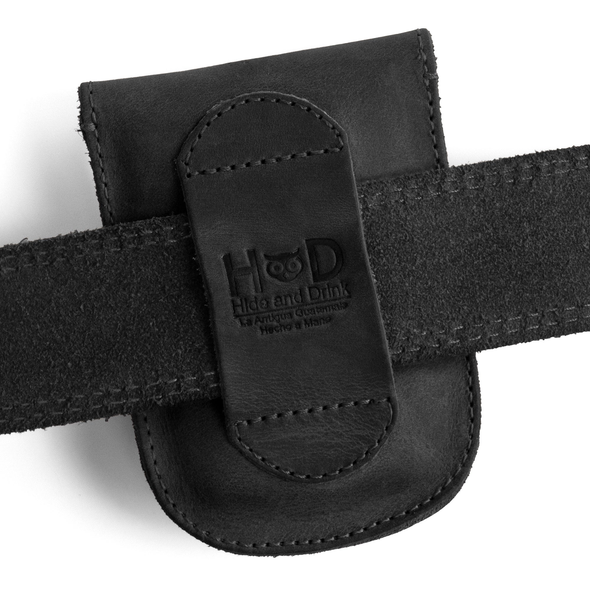 Holster Pouch crafted by Hide & Drink displayed on a belt, highlighting its handmade design and convenient access. This full grain leather pocket wallet is ideal for carrying personal items, made with small batch artisan craftsmanship.