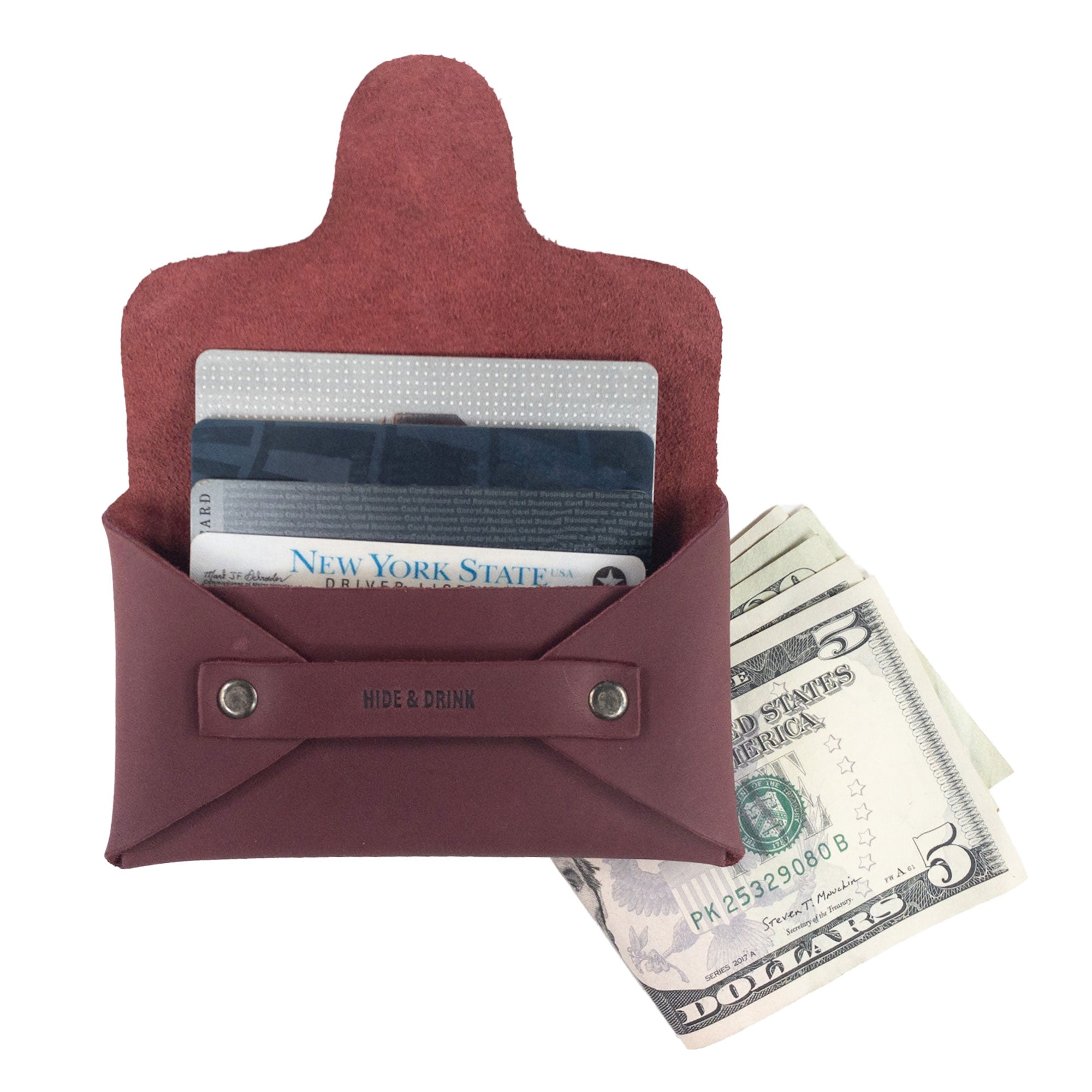 Hide & Drink's Snapless Business Card Holder with cards and cash inside. This wallet represents the perfect Snapless Business Card Holder for Men and Women, serving as a sturdy pouch and money organizer. With its elegant design in Full Grain Leather, it showcases small batch production along with hand cut, hand sewn, and fire branded artisan details from La Antigua Guatemala & Oaxaca Mexico.