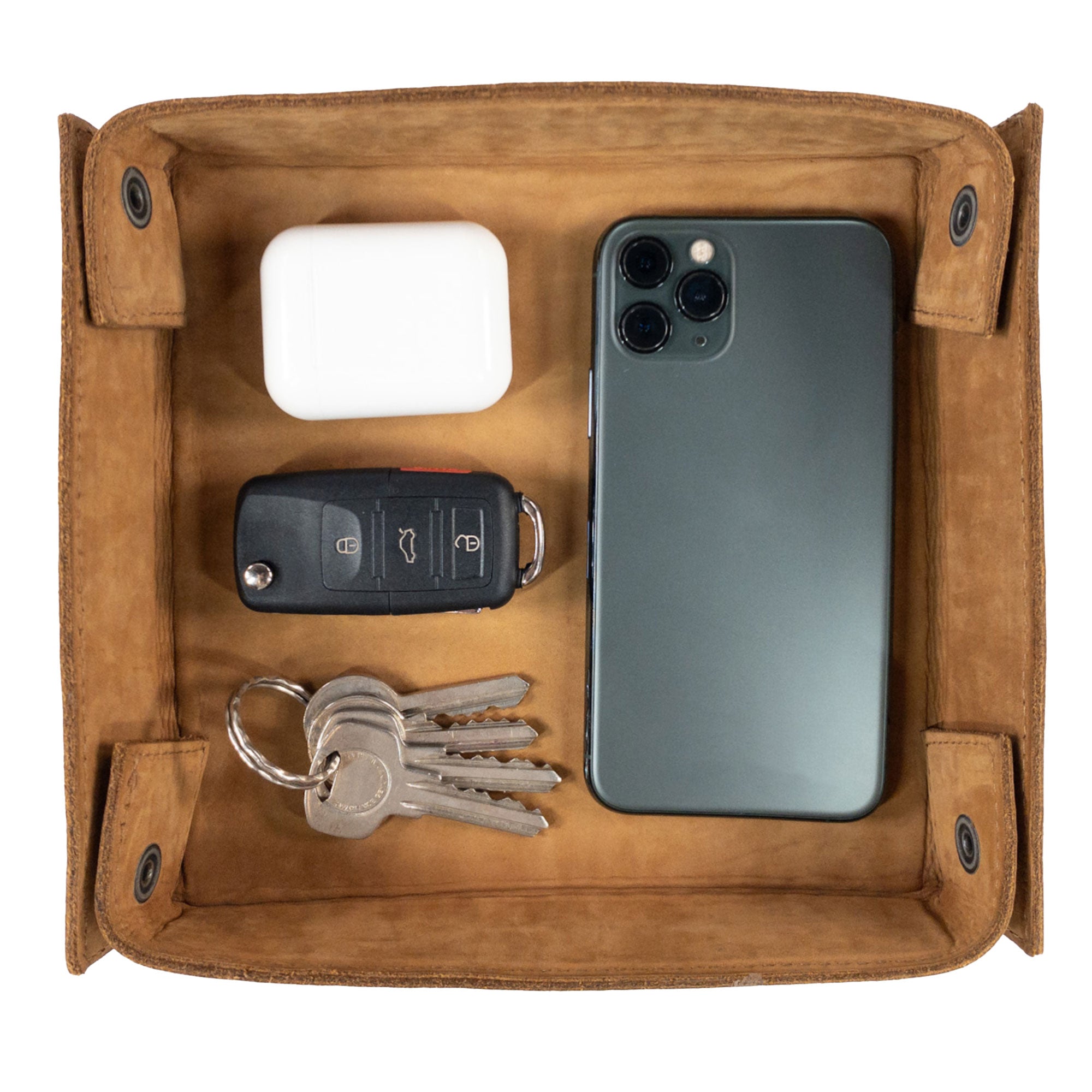 Hide & Drink Jumbo Tray, a durable catchall crafted from full grain leather, perfect for organizing small belongings like keys and jewelry. Handmade by artisans in La Antigua Guatemala, this tray adds vintage charm to any space.