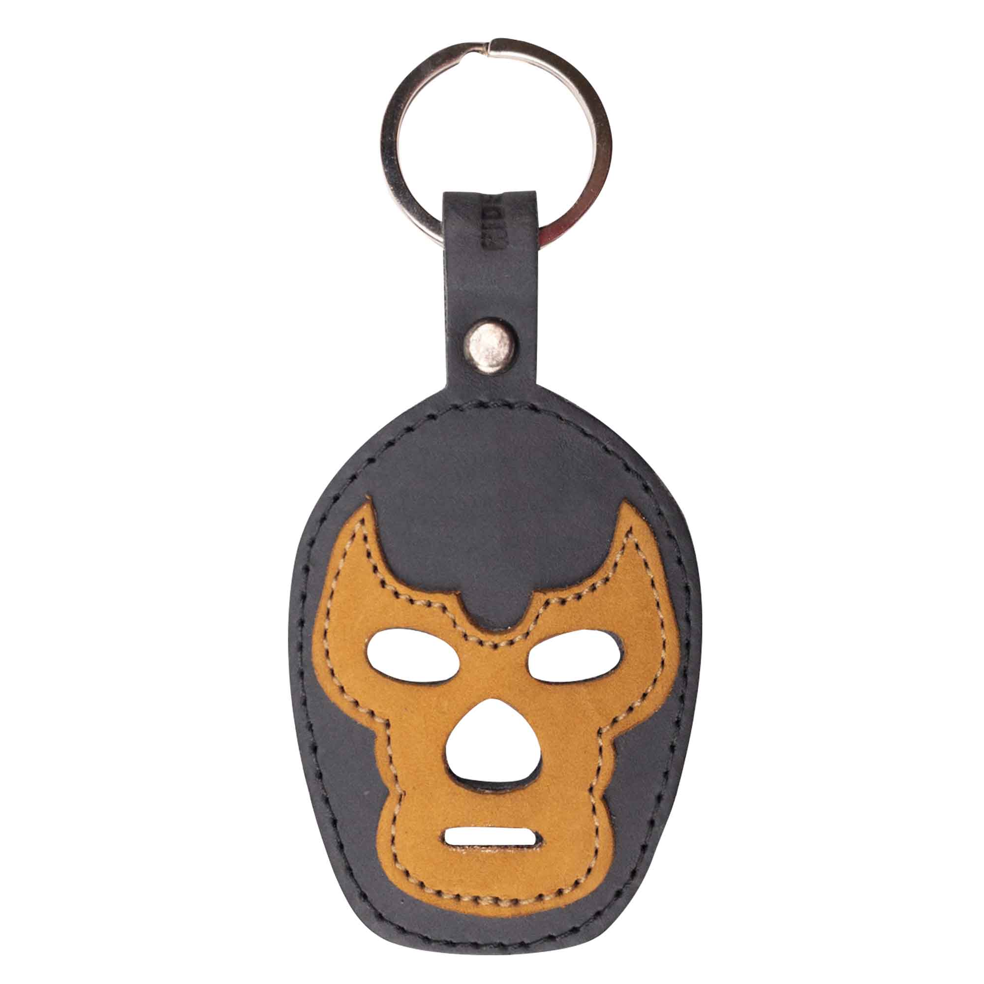 A detailed view of the Luchador Mask Leather Keychain, emphasizing the craftsmanship of its design. This stylish keyring by Hide & Drink is a functional key organizer crafted from full grain leather, showcasing the values of small batch production through artisan skills, hand cut and hand sewn in La Antigua Guatemala and Oaxaca Mexico.
