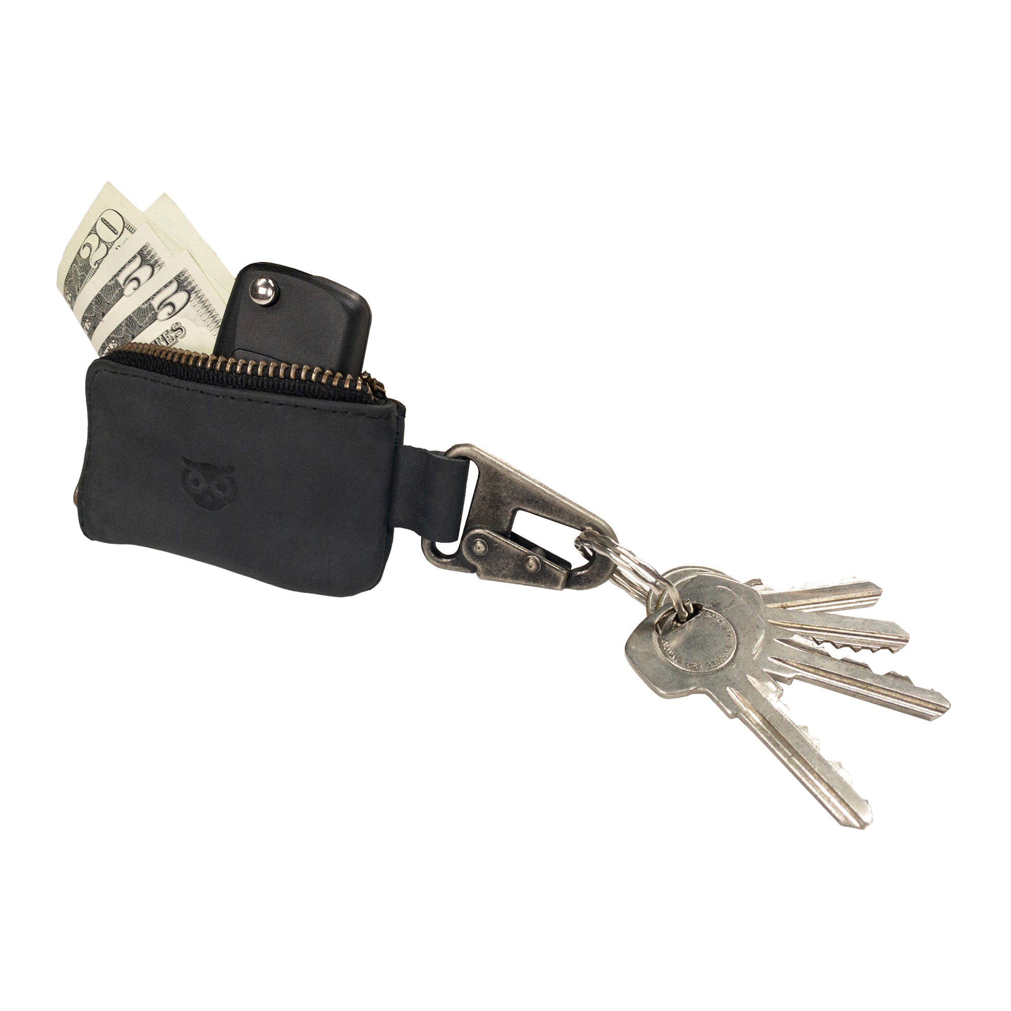 An elegant display of the Car Key Holder from Hide & Drink, featuring cash and keys for a stylish accessory. This Car Key Holder's secure zipper case is perfect for storing headphone and charging cables, memory cards, and flash drives, enhanced by its nickel metal clasp design, made from full grain leather. Appreciate the artisan details with small batch production, hand cut, hand sewn quality, handmade in La Antigua Guatemala & Oaxaca Mexico.