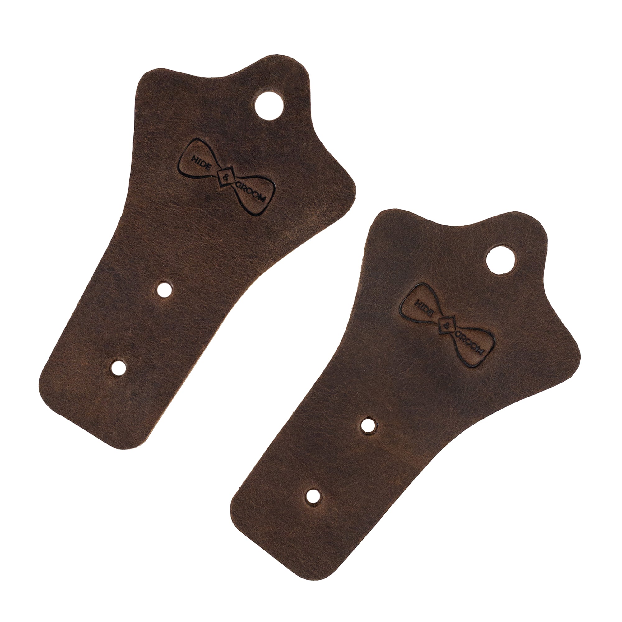Hide & Groom Set of 2 Buckle Belt Hangers shown together, perfect for keeping belts organized. Featuring full grain leather, these rustic organizers are well suited as groomsmen gifts. Handmade in La Antigua Guatemala, this artisan product is hand cut and sewn, ensuring quality in every detail.