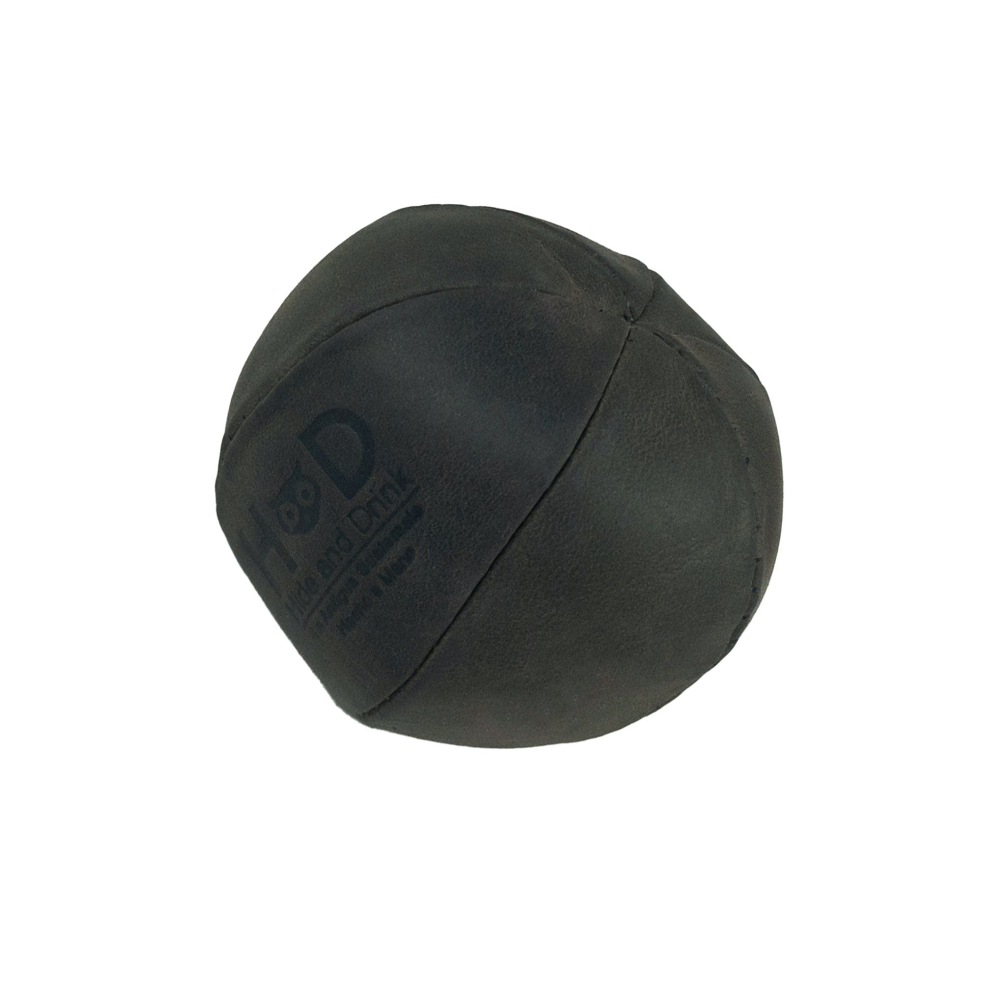 Hide & Drink green Stress Ball showcasing fine stitching, ideal for relieving fidgeting and anxiety while exercising hand muscles. This squishy tension accessory is handcrafted from full grain leather in La Antigua Guatemala.