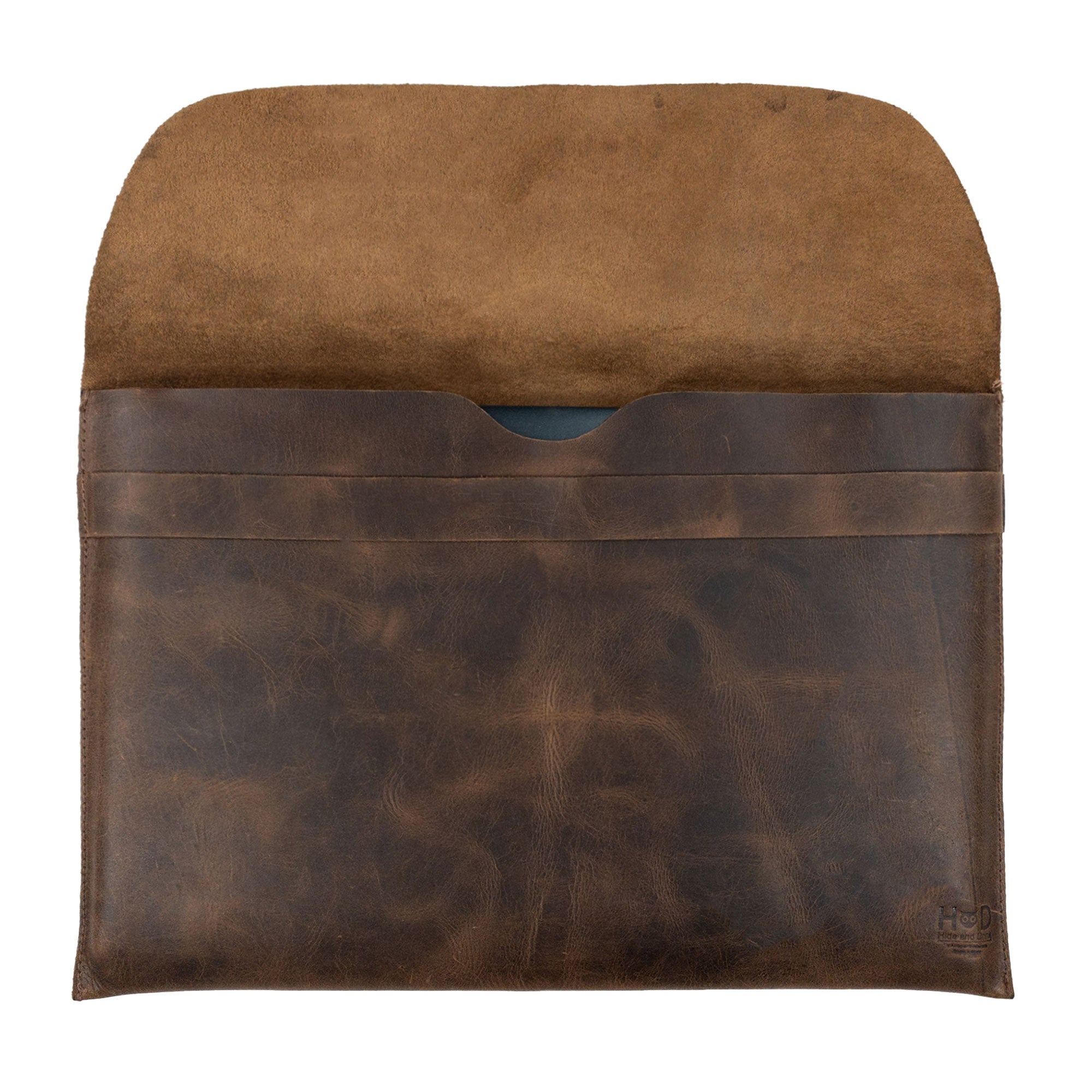 Inside view of the MacBook Slim Case from Hide & Drink, revealing its soft interior lining for optimum protection. This case is compatible with MacBook Air/Pro 13 Inch with M1 Chip, showcasing quality full grain leather, artisan craftsmanship, and small batch production from StockyardX.