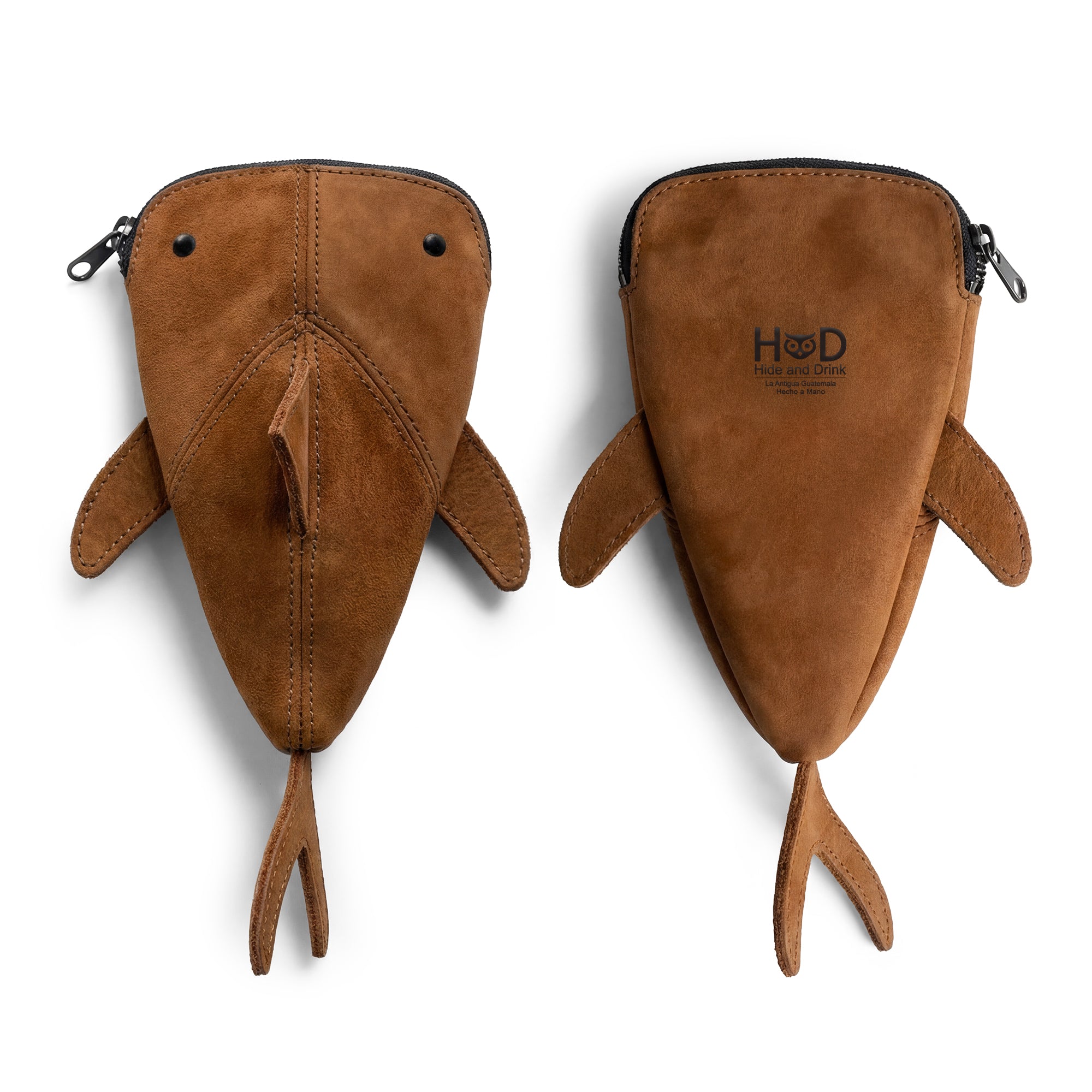Top view of Hide & Drink Leather Shark Pouch highlighting its unique shark shape and artisan detail, versatile enough to serve as a wallet, makeup bag, or stuffed animal, handcrafted in small batches.