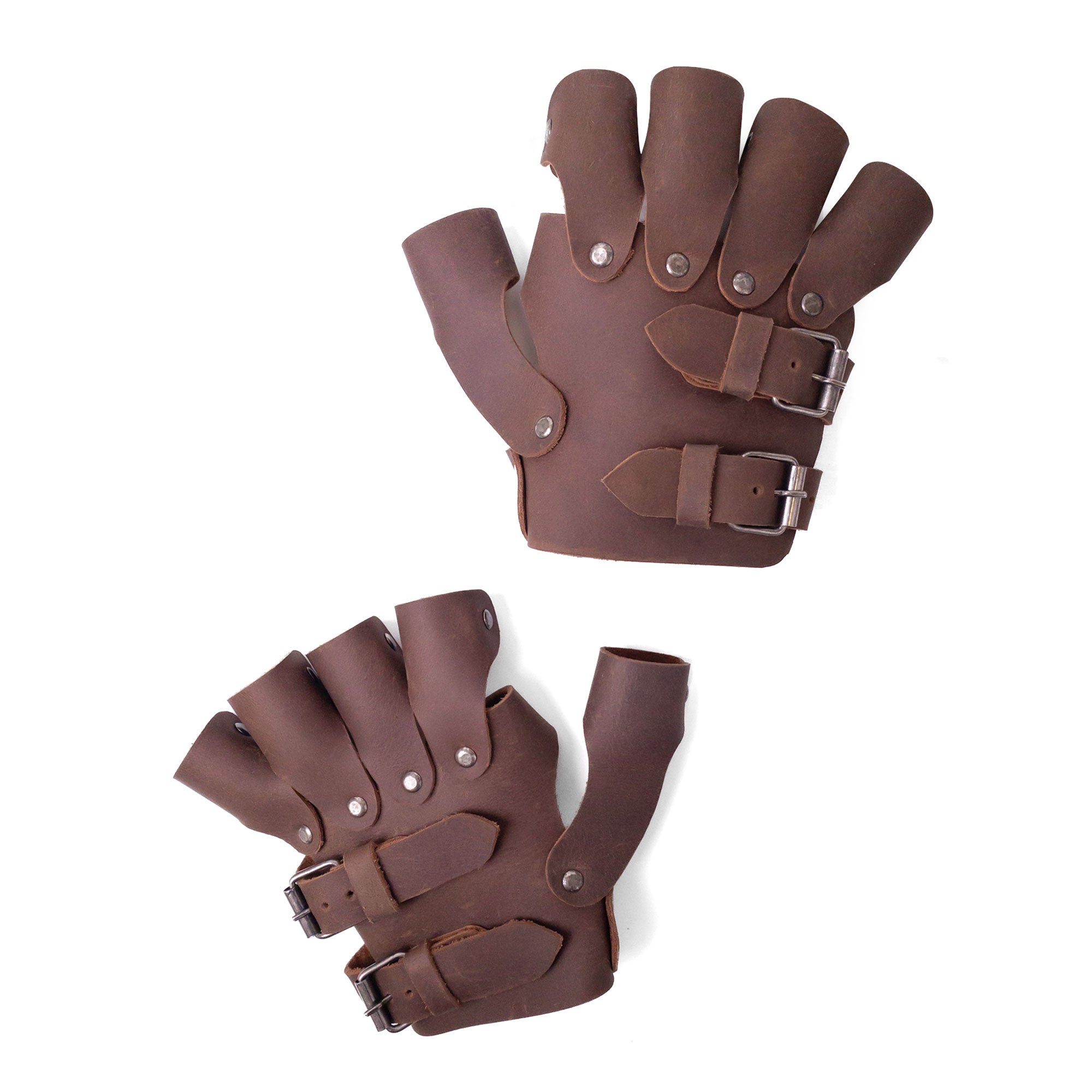 An overhead shot of the Set of 2 Steampunk Gloves, showcasing their detailed craftsmanship and full grain leather material. Made by Hide & Play, these vintage gloves are perfect for cosplay, reflecting artisan artistry with small batch production from La Antigua Guatemala.