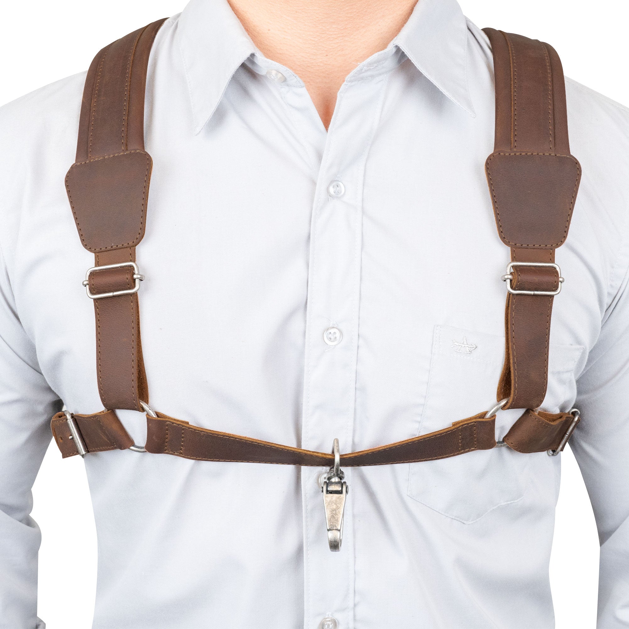 Close-up of the Ajustable Harness for Alto & Tenor Saxophone by tocame, highlighting its adjustable features and padded support for the musician's comfort. This harness, made from full grain leather, is part of the marching band essentials, showcasing artisan craftsmanship through small batch production, hand cut and hand sewn in La Antigua Guatemala and Oaxaca Mexico.