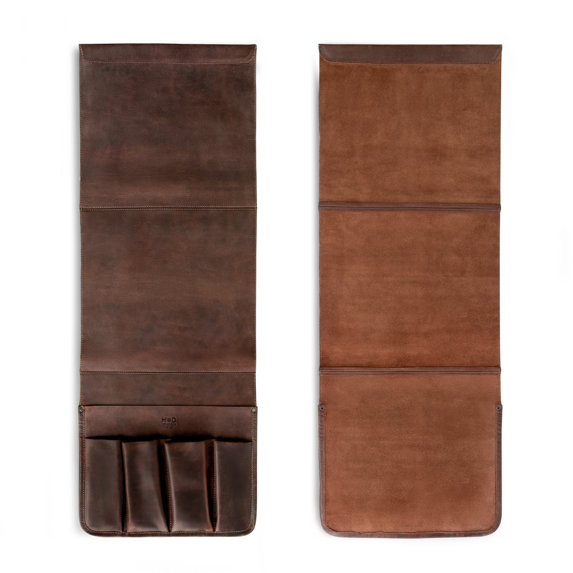 Open view of Hide & Drink's Remote Control Holder revealing its multiple sections, ideal for organizing remotes and magazines. This sofa armrest organizer pouch combines function and style, crafted from fire branded, hand cut leather by artisans in La Antigua Guatemala and Oaxaca Mexico.