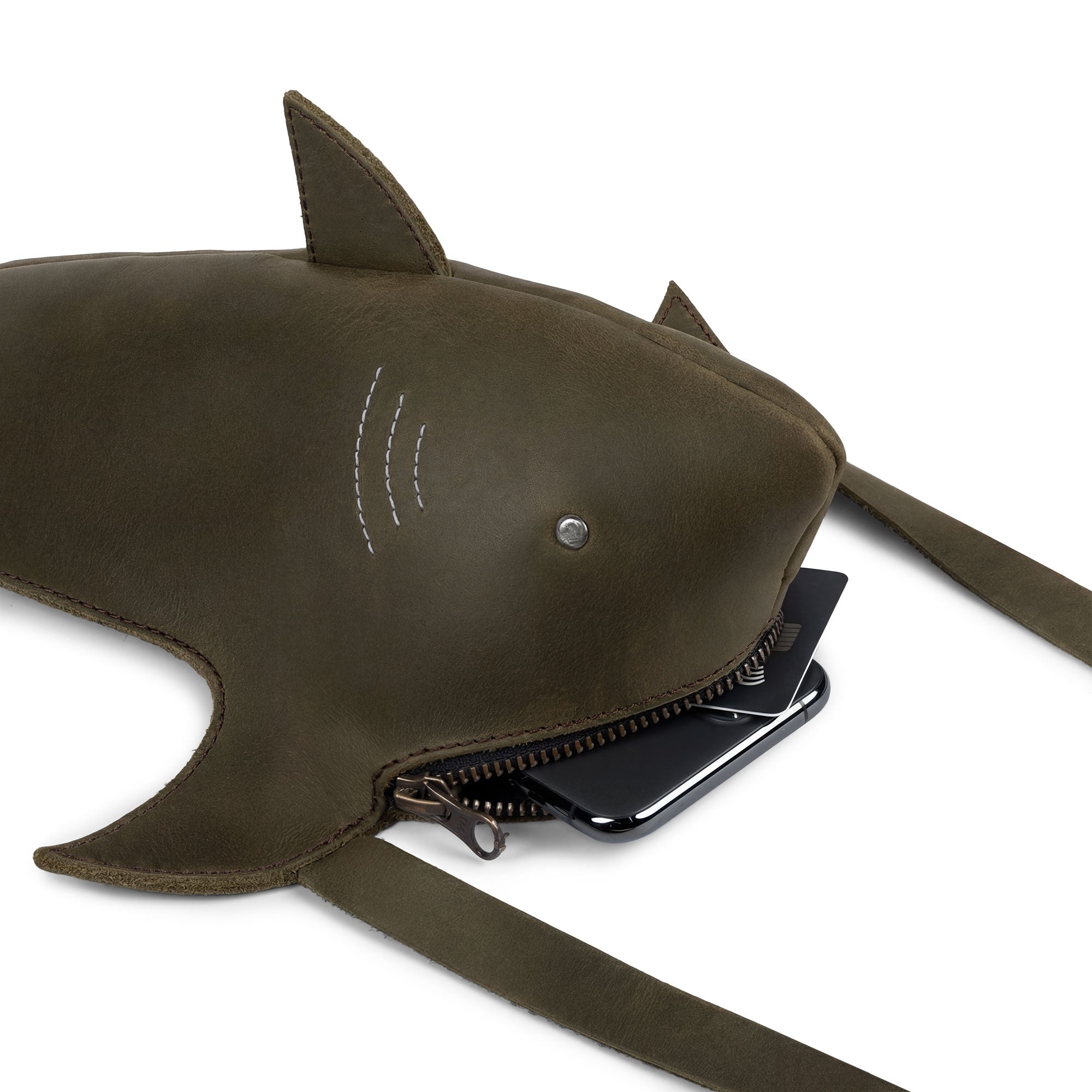 Close-up of the Shark-Shaped Shoulder Bag by Tudi Frudi, highlighting its spacious interior for essentials. Crafted from Full Grain Leather, this handmade bag is perfect as a Crossbody or Messenger Bag, showcasing artisan quality from La Antigua Guatemala.