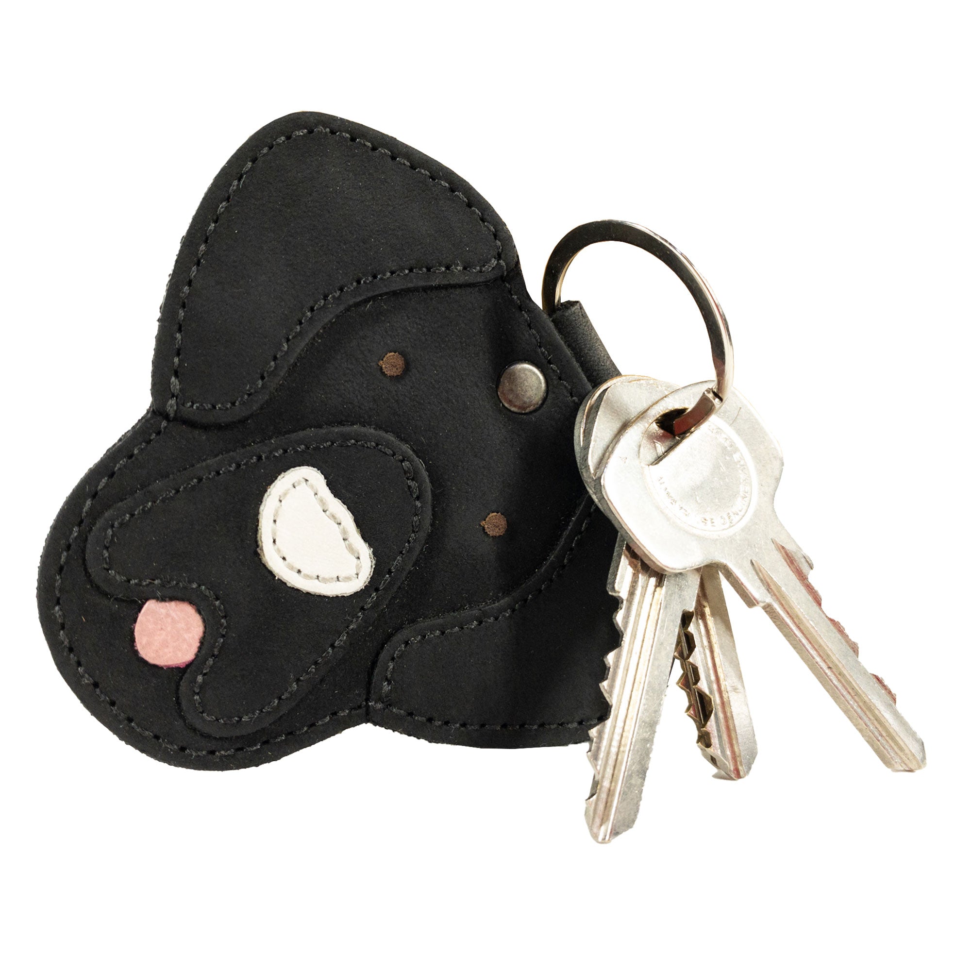 Side view of the black Labrador Dog Critter Keychain by Taco Dog, showing its stylish design and quality craftsmanship. Made from Full Grain Leather, it’s a handmade piece that reflects small batch production and artisan skills from La Antigua Guatemala.