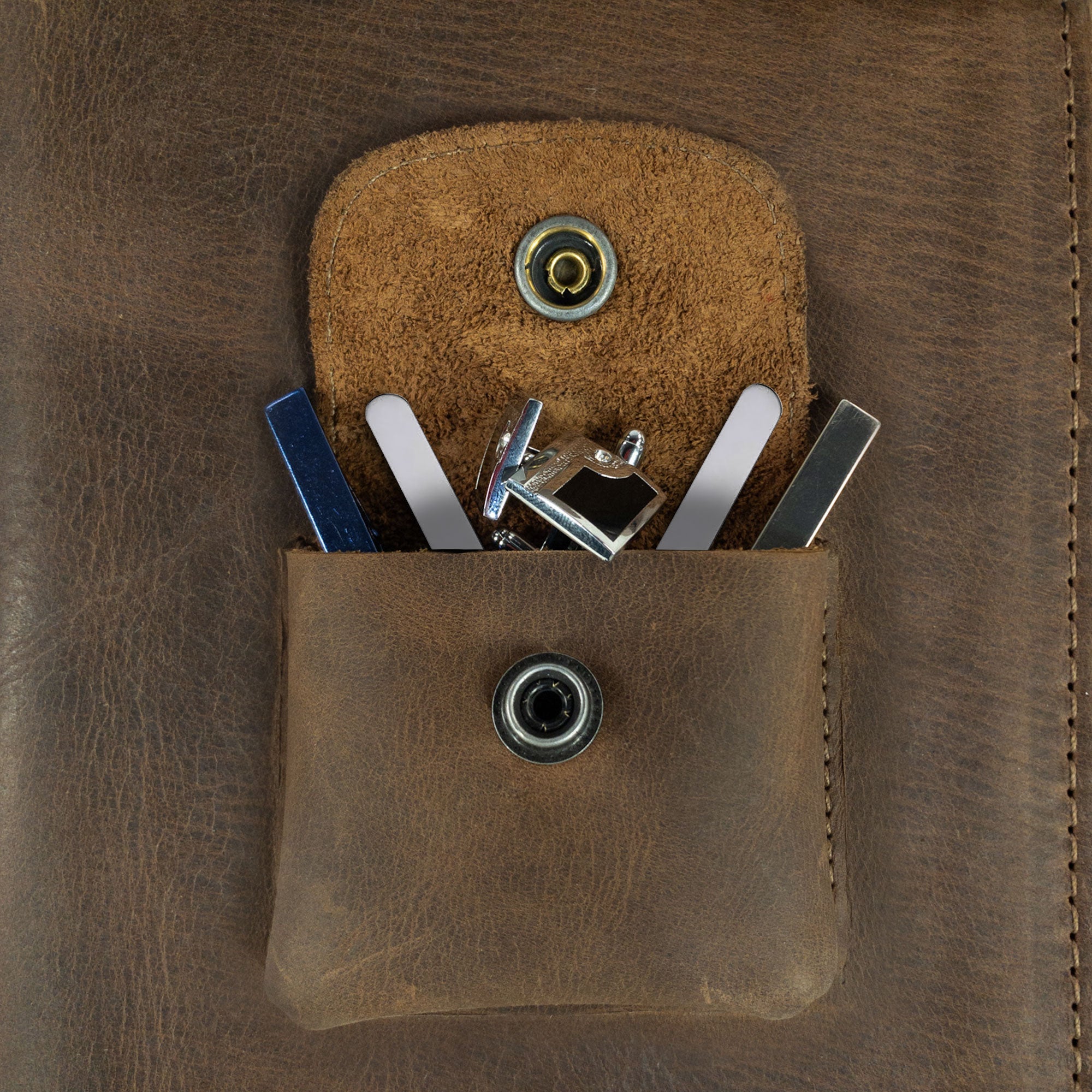 Close-up of the extra pocket inside the Travel Tie Case by Hide & Groom, designed for storing cufflinks and small accessories. This handmade case is perfect for any formal ceremony and highlights artisan craftsmanship.