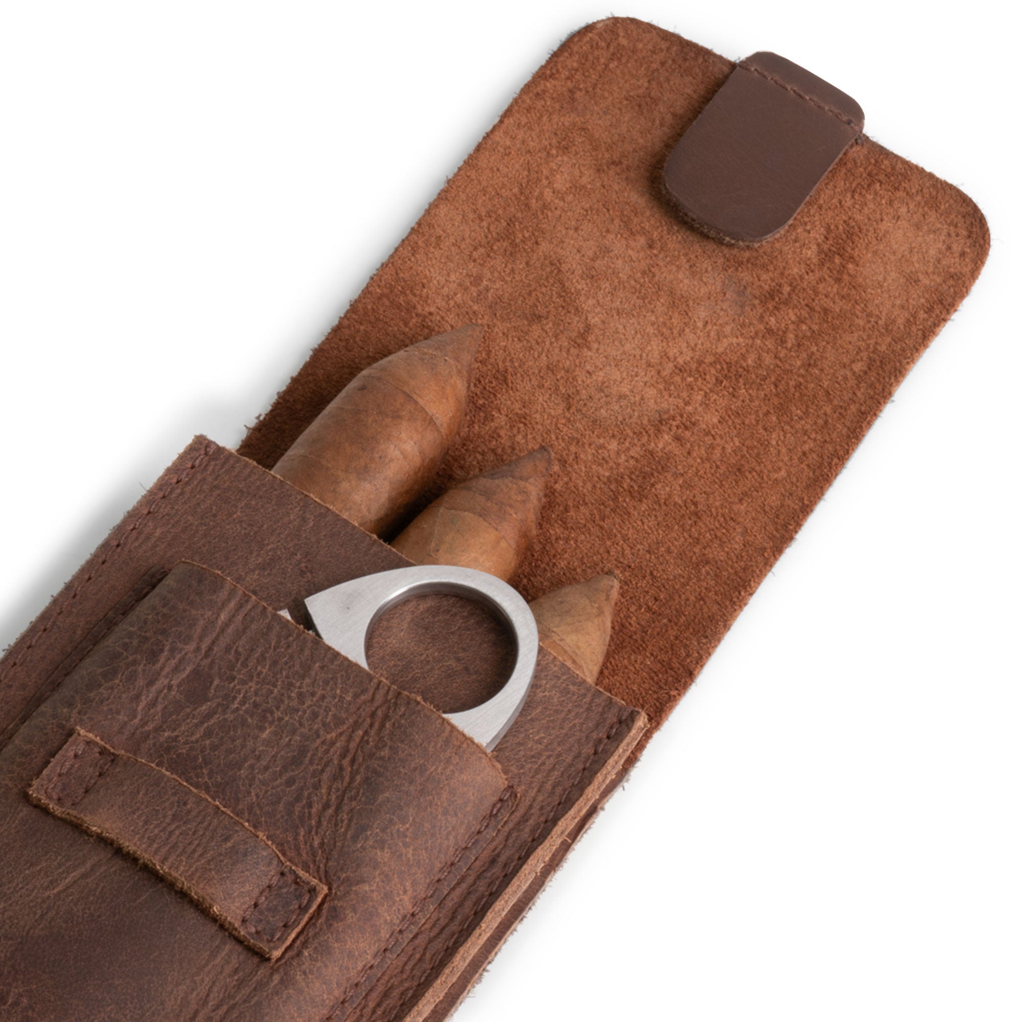 Close-up of the cutter slot within Hide & Drink's Triple Cigar Holder, showcasing meticulous stitching and full grain leather. A portable accessory that makes a great gift for men, handcrafted in La Antigua Guatemala & Oaxaca Mexico.