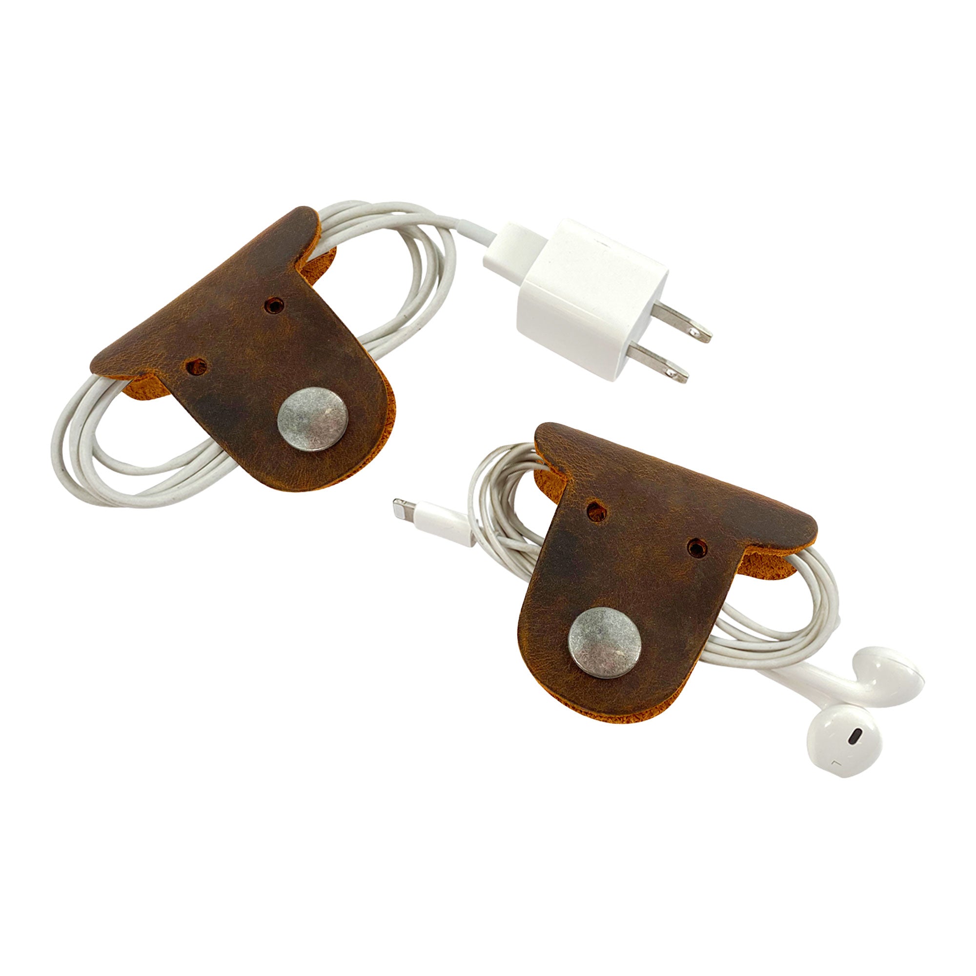 Stay stylish while wrapping your cables with Taco Dog's Dog Cord Keepers, crafted from full grain leather. These cute, handcrafted accessories allow you to manage your headphones and chargers easily. Enjoy the small batch production quality of these artisan pieces made in La Antigua Guatemala.