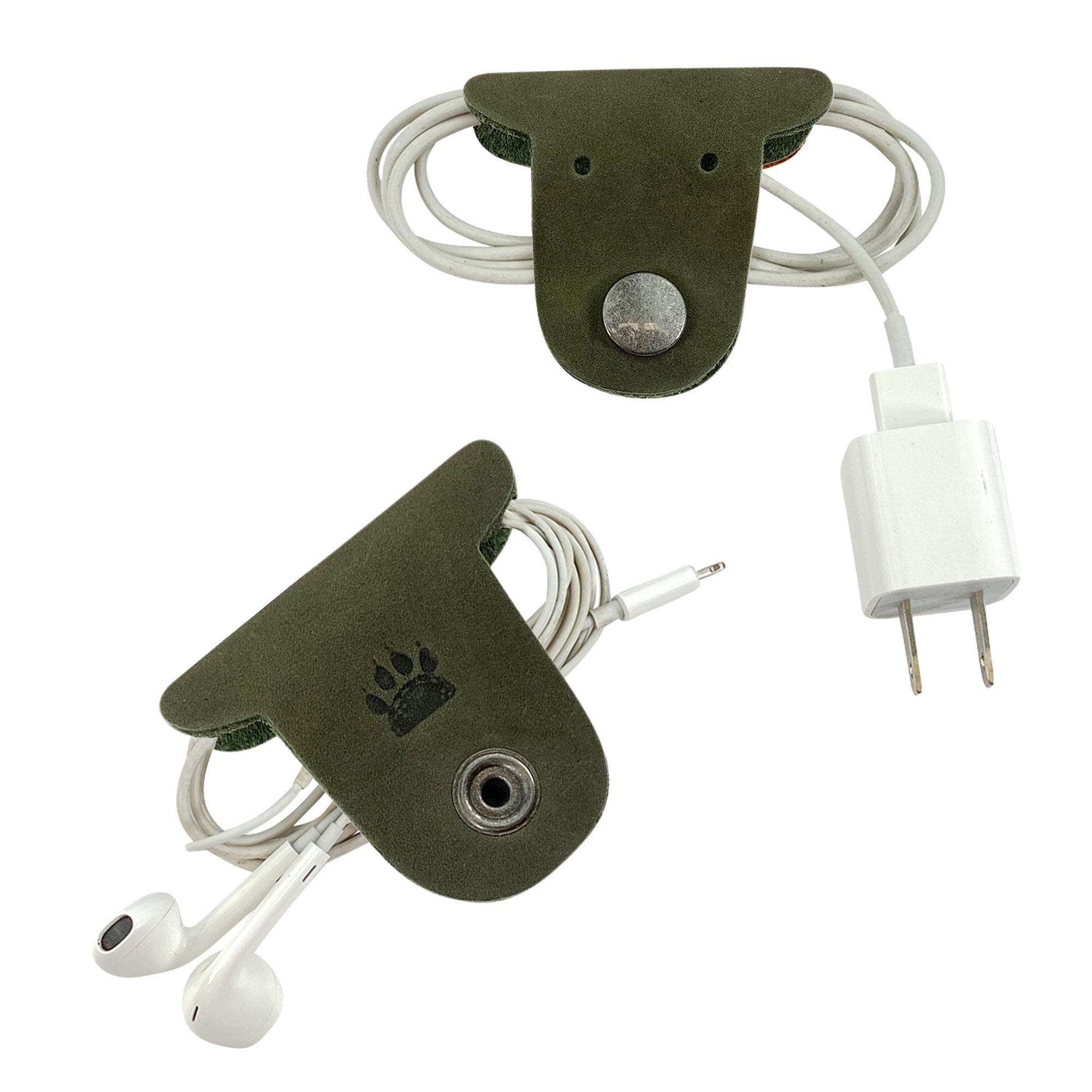 Keep your cords tidy with Taco Dog's Dog Cord Keepers featuring a unique design for wrapping headphones and chargers. These green full grain leather accessories are handmade with care, providing practical and stylish organization for travel. Experience the artisan quality from La Antigua Guatemala.