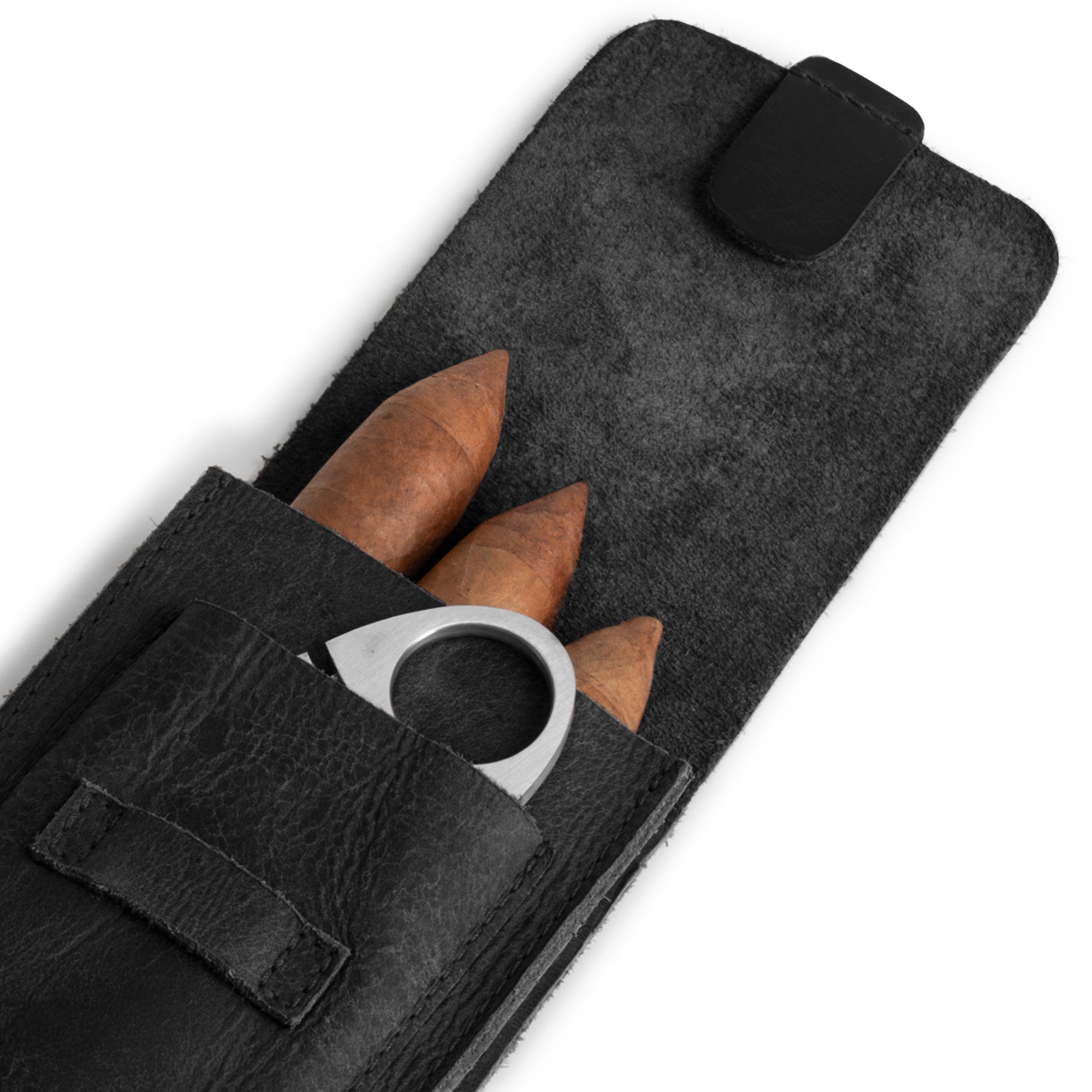 Close-up of the cutter slot within the black Triple Cigar Holder by Hide & Drink, reflecting exquisite craftsmanship. This travel leather cigar case is ideal for gift-giving, holding 3 cigars and made from full grain leather, handmade in La Antigua Guatemala & Oaxaca Mexico.