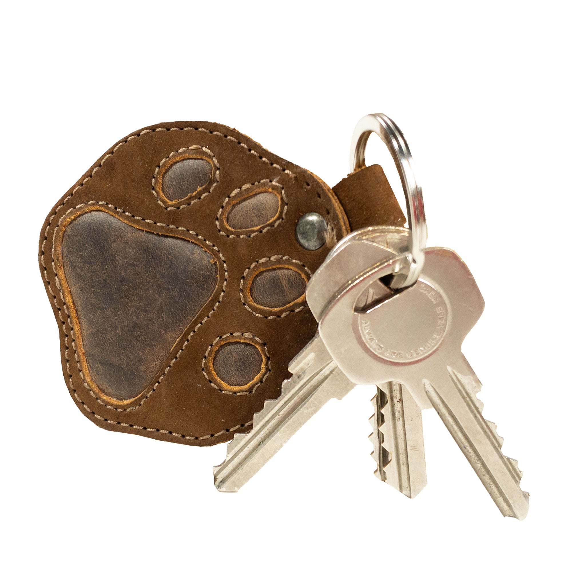 Stylish Dog Paw Keychain from Taco Dog, showcasing a stitched full grain leather design. Perfect as a key ring fob and a cute pet holder charm pendant gift. Hand cut and sewn, this artisan piece is made in La Antigua Guatemala & Oaxaca Mexico, emphasizing small batch production.