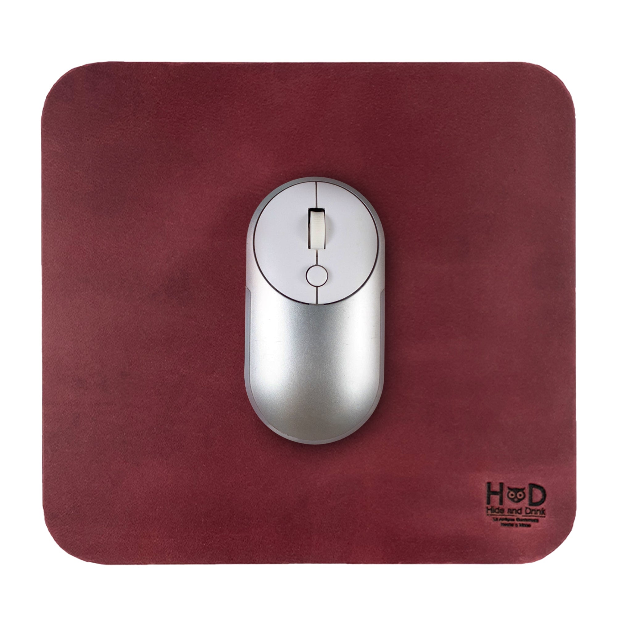 Hide & Drink Mousepad showcasing a rich red finish, ideal for a stylish workspace. This artisan-crafted genuine leather mousepad provides ergonomic comfort and stability, handmade in La Antigua Guatemala & Oaxaca Mexico.