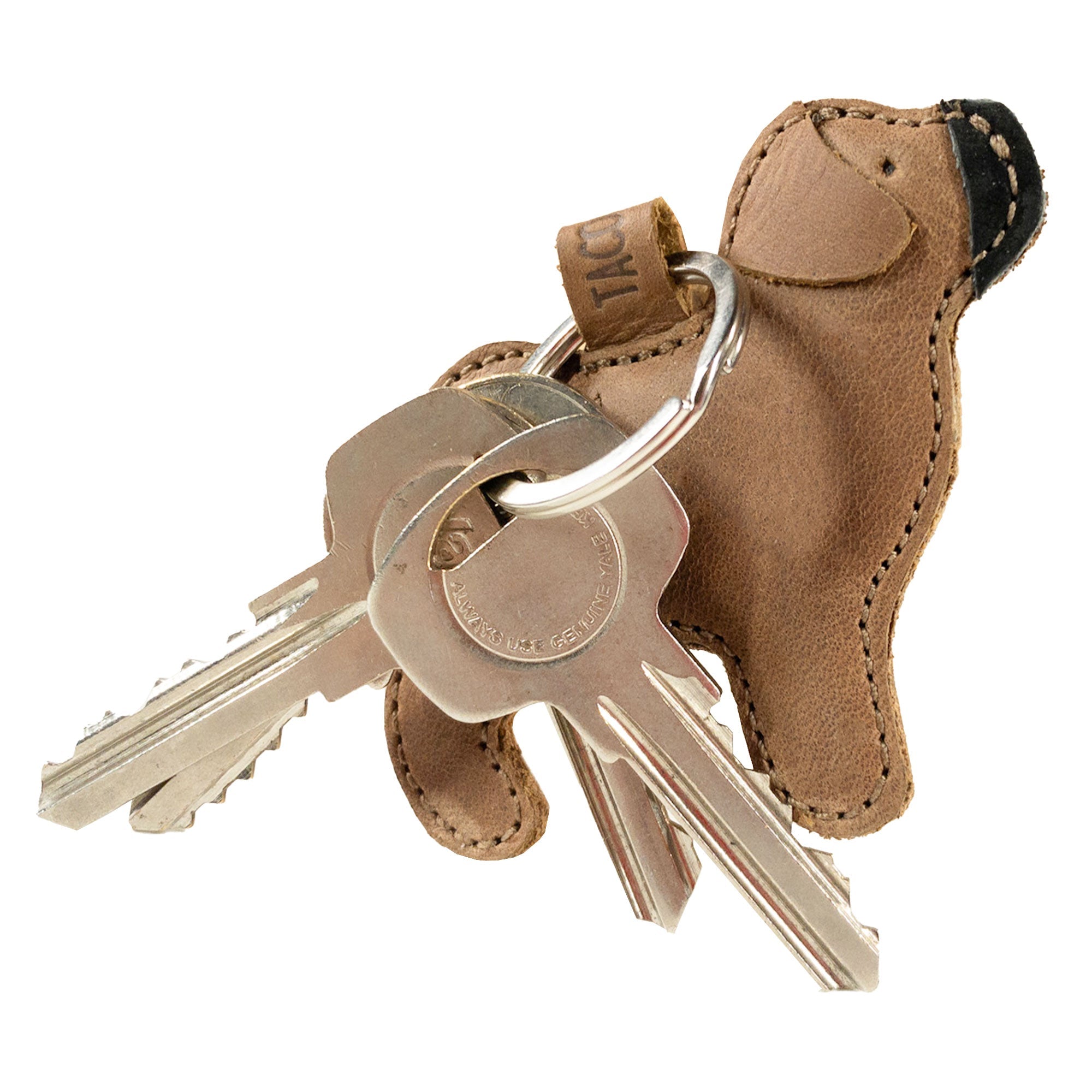 Functional Pug Keychain by Taco Dog featuring a charming design while securely holding keys. This durable, all-natural full grain leather keychain has an adorable rustic look and rich handmade details, making it a fantastic gift for dog lovers. Lightweight and practical, it embodies artisan craftsmanship from La Antigua Guatemala & Oaxaca Mexico.