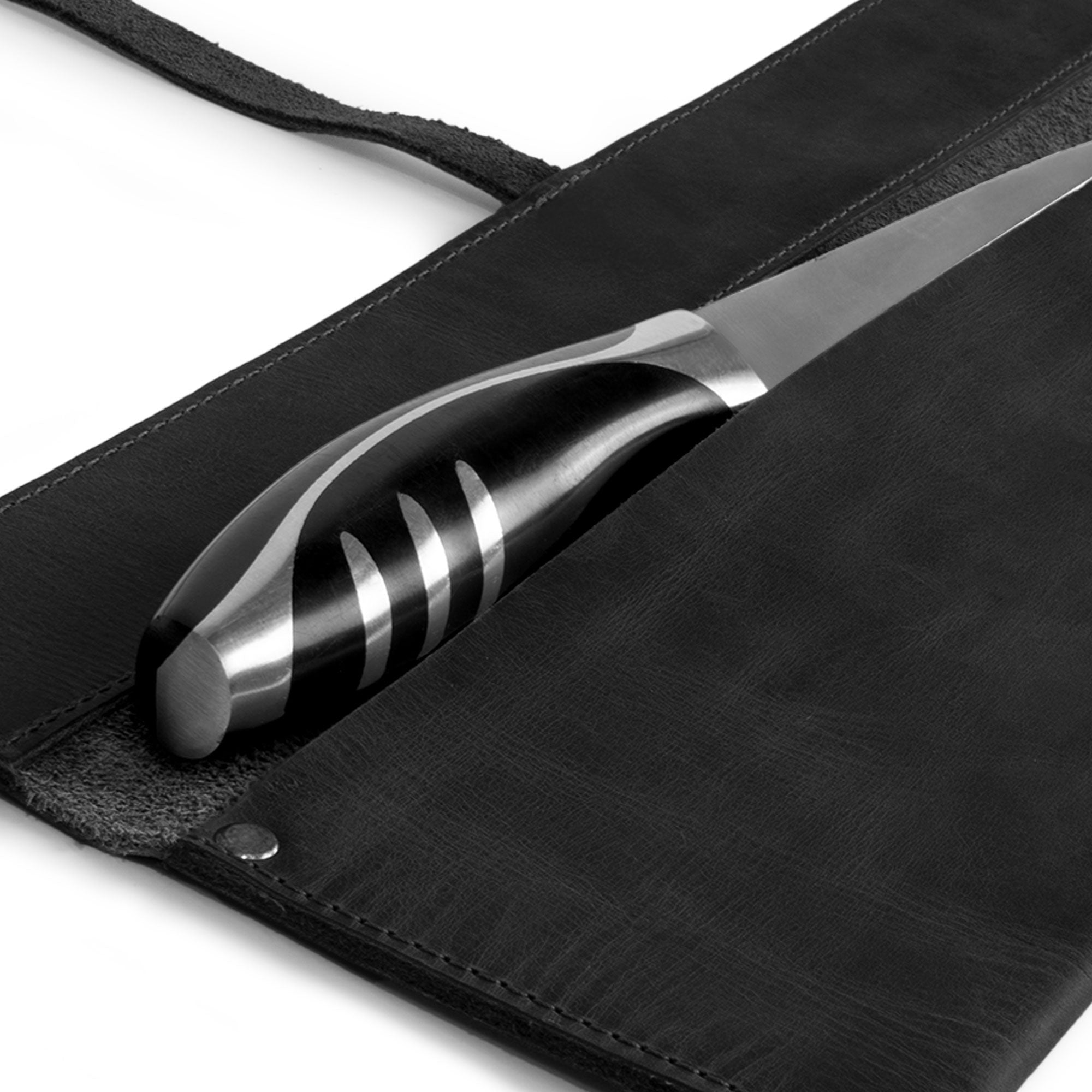 Detail of the blade compartment of Cast Leather Co. Single Leather Knife Case in black, showcasing the stylish interior. This leather chef knife sheath is crafted from artisanal full grain leather in La Antigua Guatemala, offering chefs a professional carrying option for knives. A must-have for any kitchen!